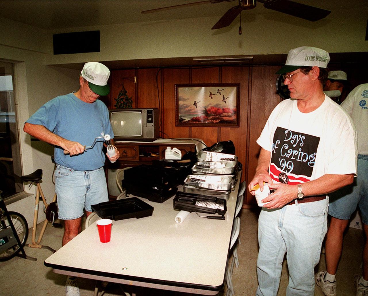Volunteers for Days of Caring '99 set up the paint trays for painting at Baxley Manor, an apartment building for senior citizens on Merritt Island. Coordinated by the KSC Community Relations Council, Days of Caring provides an opportunity for employees to volunteer their services in projects such as painting, planting flowers, reading to school children, and more. Organizations accepting volunteers include The Embers, Yellow Umbrella, Serene Harbor, Domestic Violence Program, the YMCA of Brevard County, and others