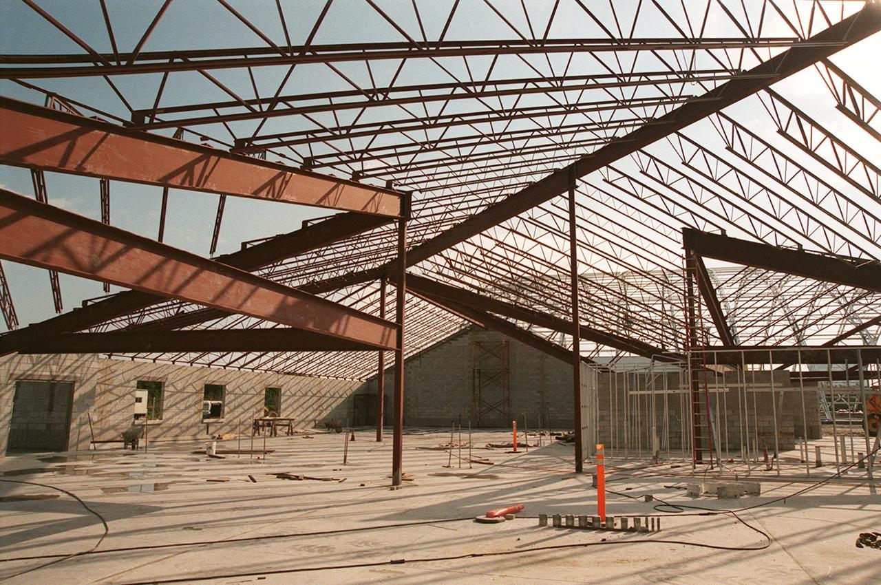 Girders overhead cast shadows on the walls and floor of a support building under construction, part of the new $8 million Reusable Launch Vehicle (RLV) Support Complex at Kennedy Space Center. The building is to be used for related ground support equipment and administrative/technical support. The RLV complex also includes a multi-purpose hangar. The complex will be available to accommodate the Space Shuttle; the X-34 RLV technology demonstrator; the L-1011 carrier aircraft for Pegasus and X-34; and other RLV and X-vehicle programs. The facility, jointly funded by the Spaceport Florida Authority, NASA's Space Shuttle Program and KSC, will be operational in early 2000