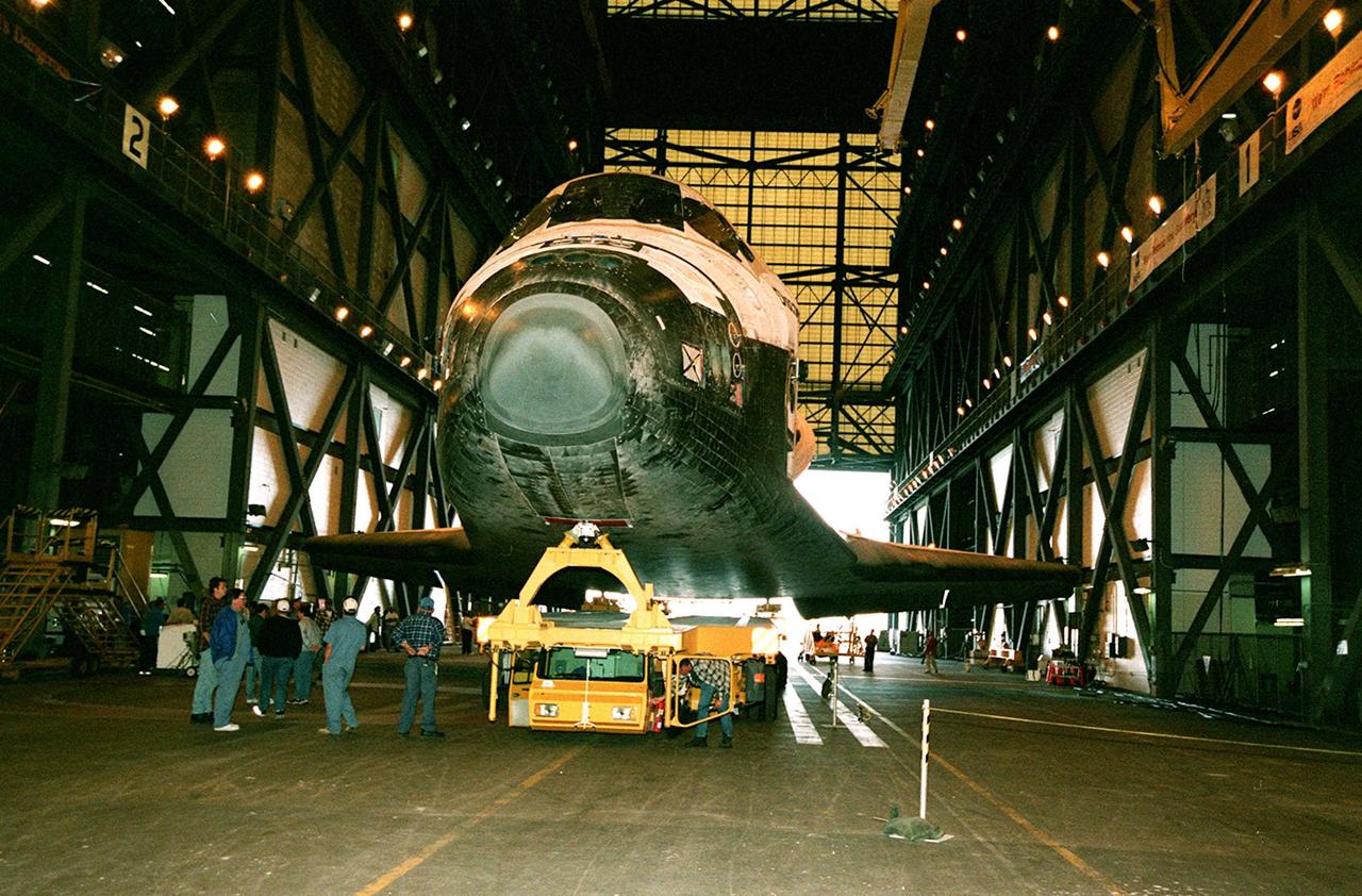 KENNEDY SPACE CENTER, FLA. -- The orbiter Discovery sits inside the Vehicle Assembly Building (VAB) after its rollover from the Orbiter Processing Facility (OPF) bay 1. In the VAB, Discovery will be mated with an external tank and solid rocket boosters for its launch on mission STS-103. The launch date is currently under review for early December. STS-103, the third Hubble Space Telescope servicing mission, is a "call-up" due to the need to replace portions of the pointing system, the gyros, which have begun to fail on the Hubble Space Telescope. Although Hubble is operating normally and conducting its scientific observations, only three of its six gyroscopes are working properly. The gyroscopes allow the telescope to point at stars, galaxies and planets. The STS-103 crew will also be replacing a Fine Guidance Sensor and an older computer with a new enhanced model, an older data tape recorder with a solid-state digital recorder, a failed spare transmitter with a new one, and degraded insulation on the telescope with new thermal insulation. The crew will also install a Battery Voltage/Temperature Improvement Kit to protect the spacecraft batteries from overcharging and overheating when the telescope goes into a safe mode