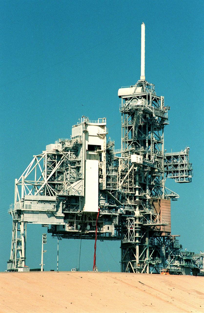 KENNEDY SPACE CENTER, FLA. -- At Launch Pad 39B, the payload canister for Space Shuttle Discovery, for mission STS-103, is lifted up the Rotating Service Structure. Installation of the payload into Discovery is slated for Friday, Nov. 12. The mission is a "call-up" due to the need to replace portions of the pointing system, the gyros, which have begun to fail on the Hubble Space Telescope. Although Hubble is operating normally and conducting its scientific observations, only three of its six gyroscopes are working properly. The gyroscopes allow the telescope to point at stars, galaxies and planets. The STS-103 crew will also be replacing a Fine Guidance Sensor and an older computer with a new enhanced model, an older data tape recorder with a solid-state digital recorder, a failed spare transmitter with a new one, and degraded insulation on the telescope with new thermal insulation. The crew will also install a Battery Voltage/Temperature Improvement Kit to protect the spacecraft batteries from overcharging and overheating when the telescope goes into a safe mode
