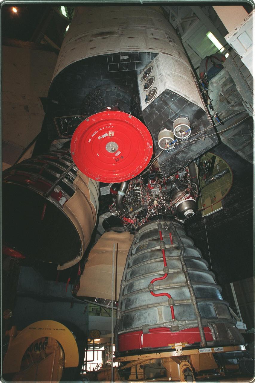 KENNEDY SPACE CENTER, FLA. -- Inside the Vehicle Assembly Building, main engine No. 3 (bottom right) is being removed from Space Shuttle Discovery. Above it are (left) the Orbital Maneuvering System (OMS) engine, the reaction control thrusters (right), and the OMS pod (top). Last week, Shuttle managers determined that the engine was not acceptable for flight because a half-inch-long broken drill bit is lodged in the engine's coolant cavity. Therefore, the engine is being replaced. The Shuttle is expected to roll out to the pad at 2 a.m. Saturday morning, Nov. 13. The STS-103 launch is now targeted for Dec. 6 at 2:37 a.m. EST. The 10-day mission is expected to conclude at KSC on Dec. 16 with a 12:45 a.m. landing