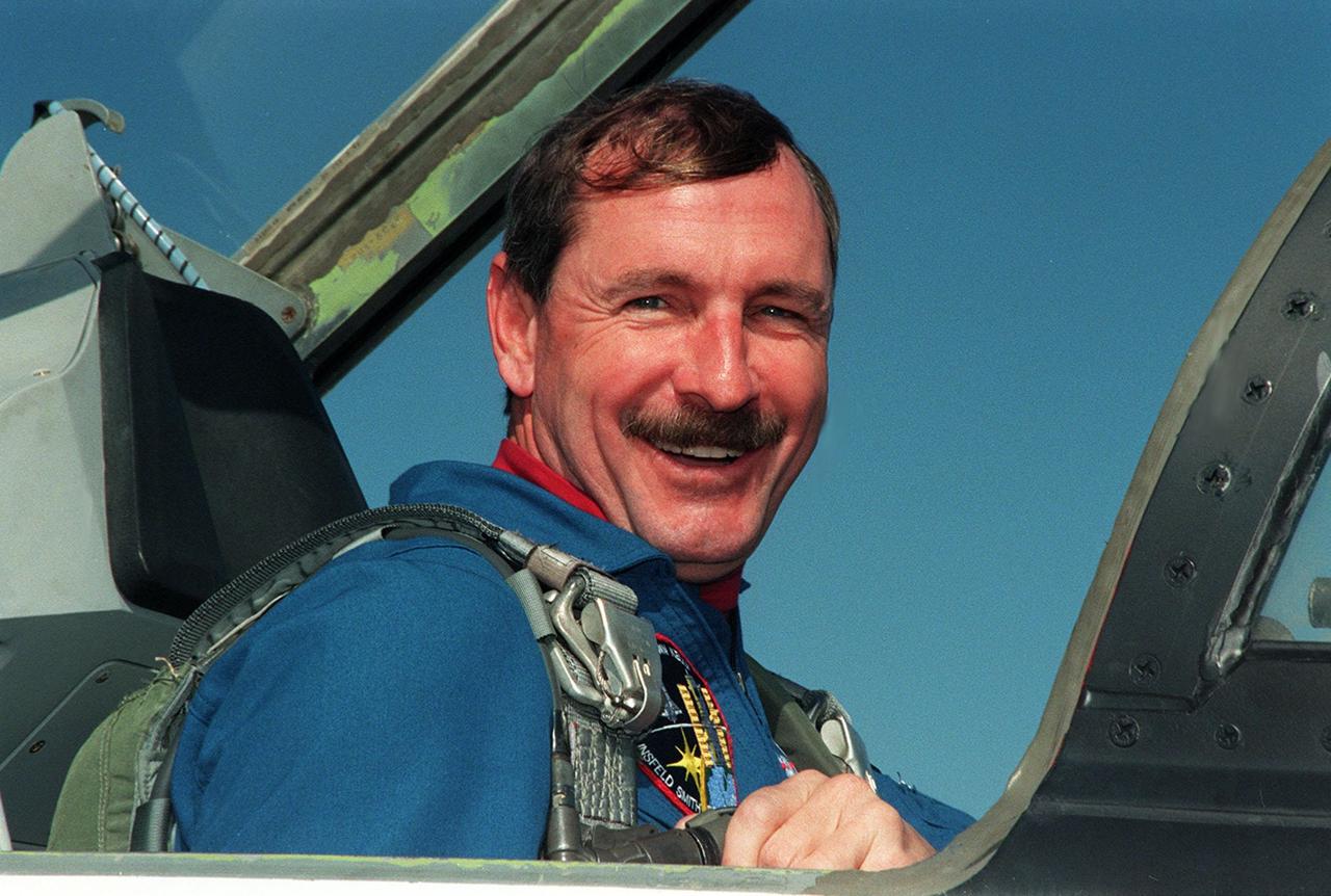 STS-103 Commander Curtis L. Brown Jr. is happy to arrive at Kennedy Space Center to begin Terminal Countdown Demonstration Test (TCDT) activities. The TCDT provides the crew with emergency egress training, opportunities to inspect their mission payloads in the orbiter's payload bay, and simulated countdown exercises. Also participating are Pilot Scott J. Kelly, and Mission Specialists Steven L. Smith, C. Michael Foale (Ph.D.), John M. Grunsfeld (Ph.D.), Claude Nicollier of Switzerland, with the European Space Agency, and Jean-François Clervoy of France, also with the European Space Agency. The mission, to service the Hubble Space Telescope, is targeted for launch Dec. 6 at 2:37 a.m. EST aboard Space Shuttle Discovery