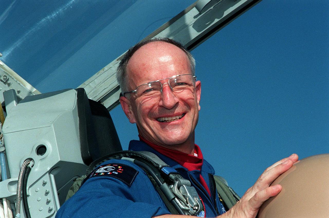 STS-103 Mission Specialist Claude Nicollier of Switzerland, with the European Space Agency, smiles after landing at Kennedy Space Center's Shuttle Landing Facility to begin Terminal Countdown Demonstration Test (TCDT) activities. The TCDT provides the crew with emergency egress training, opportunities to inspect their mission payloads in the orbiter's payload bay, and simulated countdown exercises. Also participating are Commander Curtis L. Brown Jr., Pilot Scott J. Kelly, and Mission Specialists Steven L. Smith, C. Michael Foale (Ph.D.), John M. Grunsfeld (Ph.D.), and Jean-François Clervoy of France, also with the European Space Agency. The mission, to service the Hubble Space Telescope, is targeted for launch Dec. 6 at 2:37 a.m. EST aboard Space Shuttle Discovery