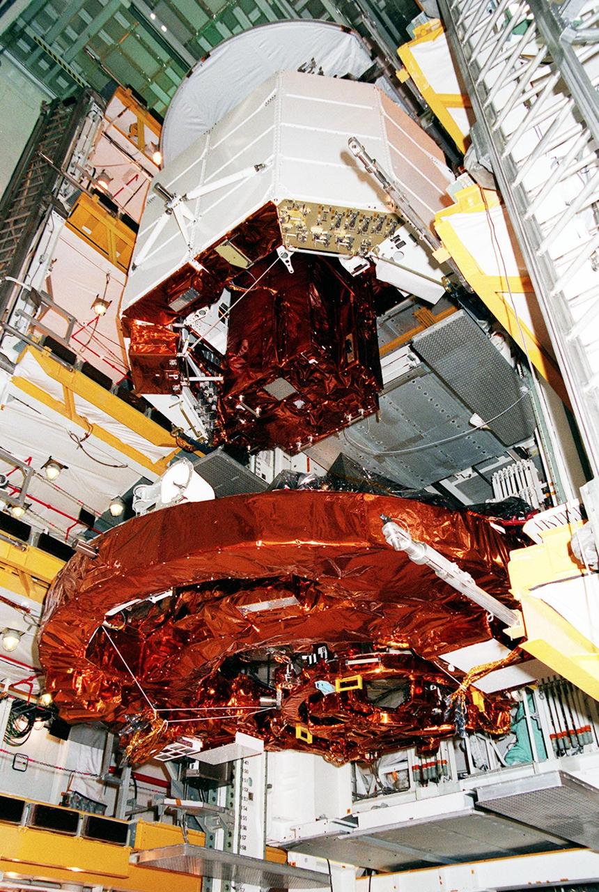 KENNEDY SPACE CENTER, FLA. -- STS-103's Hubble servicing cargo is transferred from the payload changeout room at Launch Pad 39B to the payload bay in Space Shuttle Discovery. STS-103 is a "call-up" mission due to the need to replace and repair portions of the Hubble Space Telescope, including the gyroscopes that allow the telescope to point at stars, galaxies and planets. The STS-103 crew will be replacing a Fine Guidance Sensor, an older computer with a new enhanced model, an older data tape recorder with a solid-state digital recorder, a failed spare transmitter with a new one, and degraded insulation on the telescope with new thermal insulation. The crew will also install a Battery Voltage/Temperature Improvement Kit to protect the spacecraft batteries from overcharging and overheating when the telescope goes into a safe mode. Four EVA's are planned to make the necessary repairs and replacements on the telescope. The mission is targeted for launch Dec. 6 at 2:37 a.m. EST