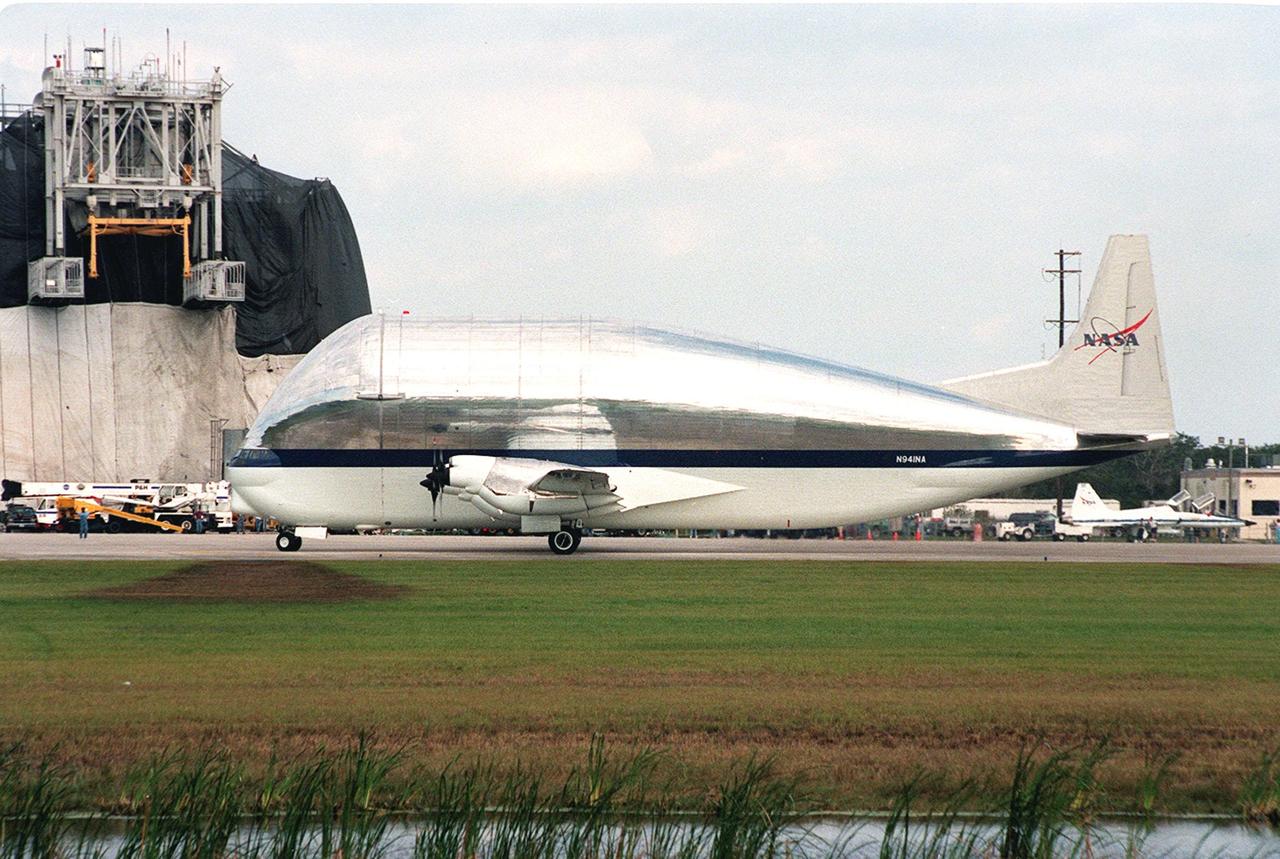 KENNEDY SPACE CENTER, FLA. -- NASA's Super Guppy aircraft arrives at Kennedy Space Center's Shuttle Landing Facility. The plane carries a component for the International Space Station (ISS), the port-side P3 truss. The truss is scheduled to be added to the ISS on mission STS-115 in 2002 aboard Space Shuttle Atlantis. The second port truss segment, P3 will be attached to the first port truss segment (P1). The P3 truss will be taken to the Operations and Checkout Building