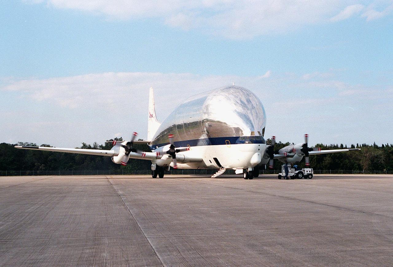 KENNEDY SPACE CENTER, FLA. -- NASA's Super Guppy aircraft arrives at Kennedy Space Center's Shuttle Landing Facility. The plane carries a component for the International Space Station (ISS), the port-side P3 truss. The truss is scheduled to be added to the ISS on mission STS-115 in 2002 aboard Space Shuttle Atlantis. The second port truss segment, P3 will be attached to the first port truss segment (P1). The P3 truss will be taken to the Operations and Checkout Building.
