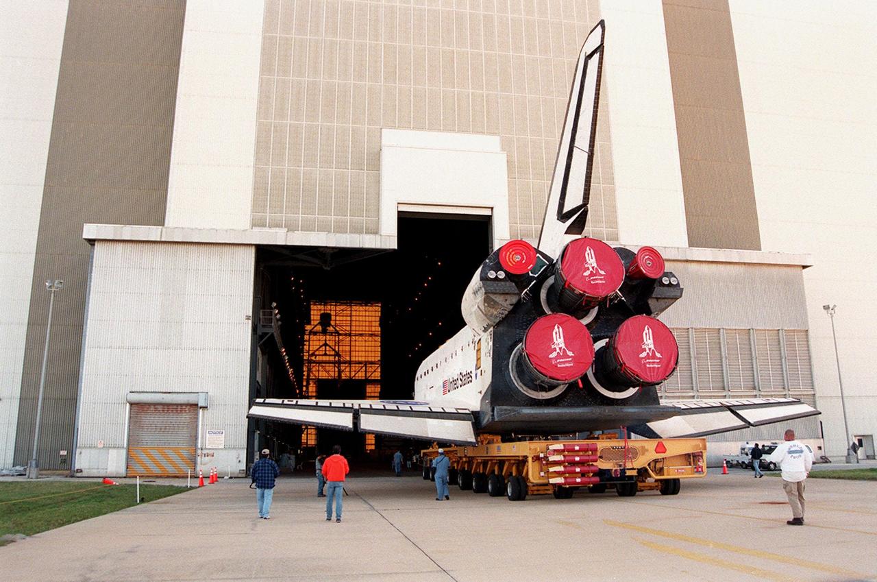 KENNEDY SPACE CENTER, FLA. -- Orbiter Endeavour rolls into the Vehicle Assembly Building on its orbiter transfer vehicle. In high bay 1 it will be mated to the external tank and solid rocket boosters. Space Shuttle Endeavour is targeted for launch on mission STS-99 Jan. 13, 2000 at 1:11 p.m. EST. STS-99 is the Shuttle Radar Topography Mission, an international project spearheaded by the National Imagery and Mapping Agency and NASA, with participation of the German Aerospace Center DLR. The SRTM consists of a specially modified radar system that will gather data for the most accurate and complete topographic map of the Earth's surface that has ever been assembled. SRTM will make use of radar interferometry, wherein two radar images are taken from slightly different locations. Differences between these images allow for the calculation of surface elevation, or change. The SRTM hardware will consist of one radar antenna in the shuttle payload bay and a second radar antenna attached to the end of a mast extended 60 meters (195 feet) out from the shuttle