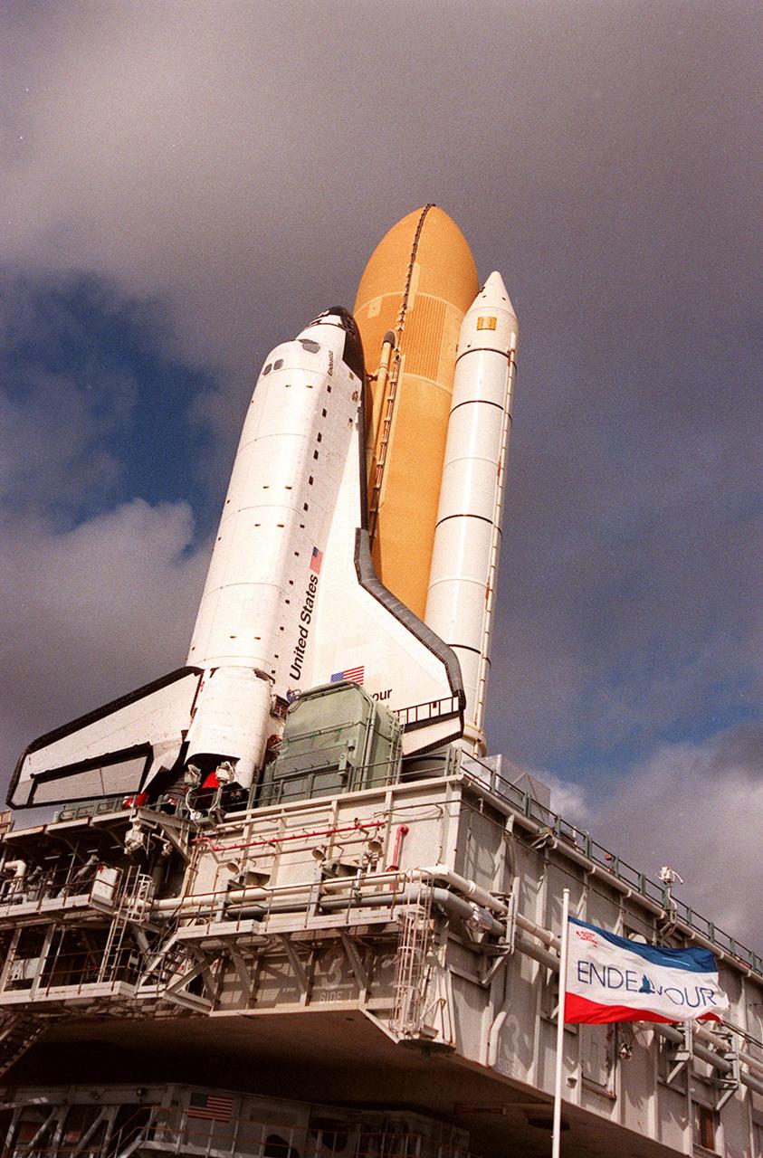 KENNEDY SPACE CENTER, Fla. -- Space Shuttle Endeavour is viewed atop the mobile launcher platform on its way to Launch Pad 39A for launch of mission STS-99. Named the Shuttle Radar Topography Mission (SRTM), STS-99 involves an international project spearheaded by the National Imagery and Mapping Agency and NASA, with participation of the German Aerospace Center DLR. SRTM will chart a new course, using two antennae and a 200-foot-long section of space station-derived mast protruding from its payload bay, to produce unrivaled 3-D images of the Earth's surface. The result of the Shuttle Radar Topography Mission could be close to 1 trillion measurements of the Earth's topography. Besides contributing to the production of better maps, these measurements could lead to improved water drainage modeling, more realistic flight simulators, better locations for cell phone towers, and enhanced navigation safety. STS-99 is scheduled for launch in January 2000