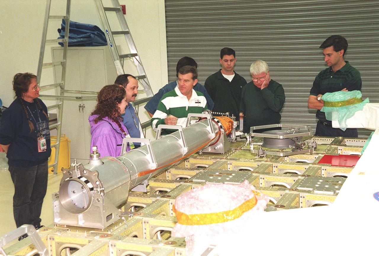 At SPACEHAB, in Titusville, Fla., members of the STS-102 crew look over the Integrated Cargo Carrier and the Russian crane Strela as part of familiarization activities. Starting second to left are Mission Specialists Susan Helms, cosmonaut Yuri Usachev, who is with the Russian Space Agency (RSA), and James Voss. STS-102 is a resupply mission to the International Space Station, transporting the Leonardo Multi-Purpose Logistics Module (MPLM) with equipment to assist in outfitting the U.S. Lab, which will already be in place. It is also transporting Voss, Helms and Usachev as the second resident crew (designated Expedition crew 2) to the station. The mission will also return to Earth the first expedition crew on ISS: William Shepherd, Sergei Krikalev (RSA) and Yuri Gidzenko (RSA). STS-102 is scheduled to launch no earlier than Oct. 19, 2000
