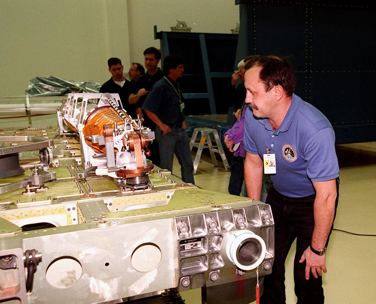 KENNEDY SPACE CENTER, FLA. -- At SPACEHAB, in Titusville, Fla., STS-102 Mission Specialist Yuri Usachev, who is with the Russian Space Agency (RSA), looks at part of the cargo on the Integrated Cargo Carrier. STS-102 is a resupply mission to the International Space Station, transporting the Leonardo Multi-Purpose Logistics Module (MPLM) with equipment to assist in outfitting the U.S. Lab, which will already be in place. It is also transporting Usachev, and Mission Specialists James Voss and Susan Helms as the second resident crew (designated Expedition crew 2) to the station. The mission will also return to Earth the first expedition crew on ISS: William Shepherd, Sergei Krikalev (RSA) and Yuri Gidzenko (RSA). STS-102 is scheduled to launch no earlier than Oct. 19, 2000