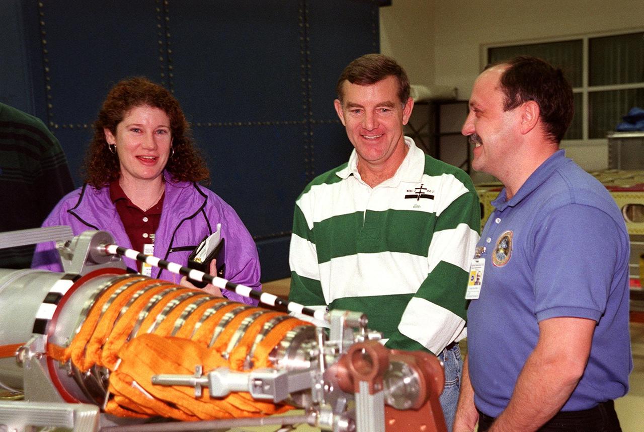 KENNEDY SPACE CENTER, FLA. -- At SPACEHAB, in Titusville, Fla., members of the STS-102 crew look at part of the equipment on the Integrated Cargo Carrier that will be on their mission. From left are Mission Specialists Susan Helms, James Voss and Yuri Usachev, who is with the Russian Space Agency (RSA). STS-102 is a resupply mission to the International Space Station, transporting the Leonardo Multi-Purpose Logistics Module (MPLM) with equipment to assist in outfitting the U.S. Lab, which will already be in place. The mission is also transporting Helms, Voss and Usachev as the second resident crew (designated Expedition crew 2) to the station. In exchange, the mission will return to Earth the first expedition crew on ISS: William Shepherd, Sergei Krikalev (RSA) and Yuri Gidzenko (RSA). STS-102 is scheduled to launch no earlier than Oct. 19, 2000.
