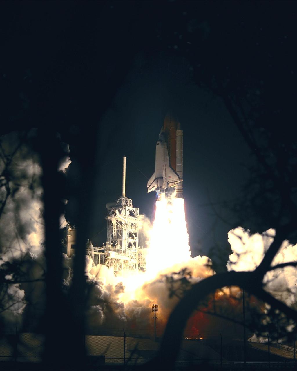 The successful liftoff of Space Shuttle Discovery on mission STS-103 illuminates the night sky. Liftoff occurred at 7:50 p.m. EST from Launch Pad 39B. On board are Commander Curtis L. Brown Jr., Pilot Scott J. Kelly and Mission Specialists Steven L. Smith, C. Michael Foale (Ph.D.), John M. Grunsfeld (Ph.D.), Claude Nicollier of Switzerland and Jean-François Clervoy of France. Nicollier and Clervoy are with the European Space Agency. STS-103 is a Hubble Servicing Mission, with three planned space walks designed to install new equipment and replace old. The primary objective is to replace the gyroscopes that make up the three Rate Sensor Units. Extravehicular activities include installing a new computer, changing out one of the Fine Guidance Sensors, replacing a tape recorder with a new solid state recorder, and installing a voltage/temperature improvement kit, and begin repairing the insulation on the telescope's outer surface. After the 7-day, 21-hour mission, Discovery is expected to land at KSC Monday, Dec. 27, at about 5:24 p.m. EST. This is the 27th flight of Discovery and the 96th mission in the Space Shuttle Program. It is the third launch at Kennedy Space Center in 1999