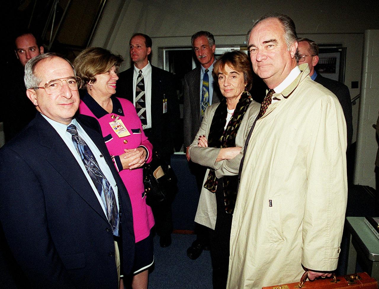 In the Firing Room (left to right) Joseph Rothenberg, associate administrator, Office of Space Flight; JoAnn Morgan, associate director for Advanced Development and Shuttle Upgrades; and Madam de L'Estang and Francois Bujon de L'Estang, ambassador of France, wait for the launch of STS-103. One of the STS-103 crew, Mission Specialist Jean-Francois Clervoy, is from France, and a member of the European Space Agency (ESA). Other crew members are Commander Curtis L. Brown Jr. , Pilot Scott J. Kelly and Mission Specialists Steven L. Smith, C. Michael Foale (Ph.D.), John M. Grunsfeld (Ph.D.) and Claude Nicollier of Switzerland (also with ESA). The mission, to service the Hubble Space Telescope, is scheduled for launch Dec. 19 at 7:50 p.m. EST from Launch Pad 39B. Mission objectives include replacing gyroscopes and an old computer, installing another solid state recorder, and replacing damaged insulation in the telescope. After the 7-day, 21-hour mission, Discovery is expected to land at KSC Monday, Dec. 27, at about 5:24 p.m. EST