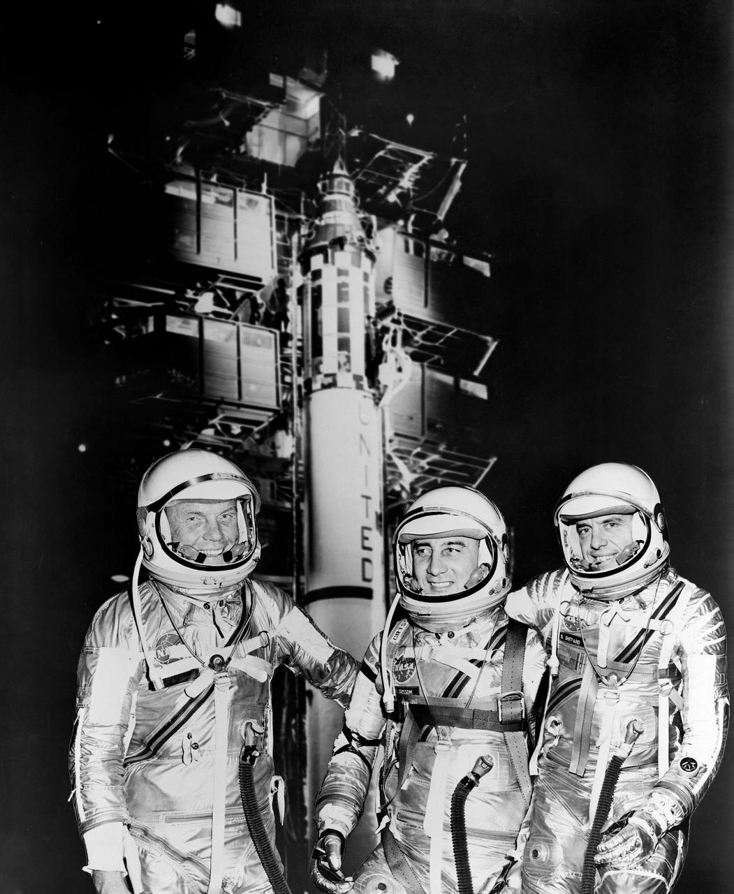 1961 -- The first three Americans in space, Mercury astronauts, from the left, John H. Glenn Jr., Virgil I. (Gus) Grissom and Alan B. Shepard Jr. standing by Redstone rocket in their spacesuits.