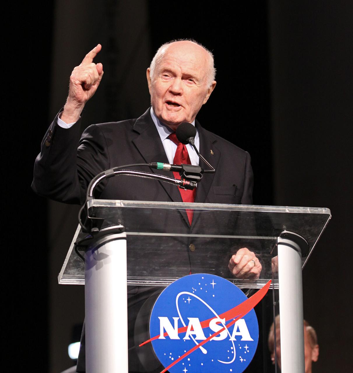 Mercury astronaut John Glenn speaks during the "On Shoulders of Giants" program celebrating 50 years of Americans in orbit, an era which began with Glenn's MA-6 mission on Feb. 20, 1962. The event was conducted in the Rocket Garden at the Kennedy Space Center Visitor Complex in Florida a few miles from the launch pad where Glenn and Scott Carpenter took flight in Mercury spacecraft. Glenn's launch aboard an Atlas rocket took with it the hopes of an entire nation and ushered in a new era of space travel that eventually led to Americans walking on the moon by the end of the 1960s. Glenn soon was followed into orbit by Scott Carpenter, Walter Schirra and Gordon Cooper. Their fellow Mercury astronauts Alan Shepard and Virgil "Gus" Grissom flew earlier suborbital flights. Deke Slayton, a member of NASA's original Mercury 7 astronauts, was grounded by a medical condition until the Apollo-Soyuz Test Project in 1975.