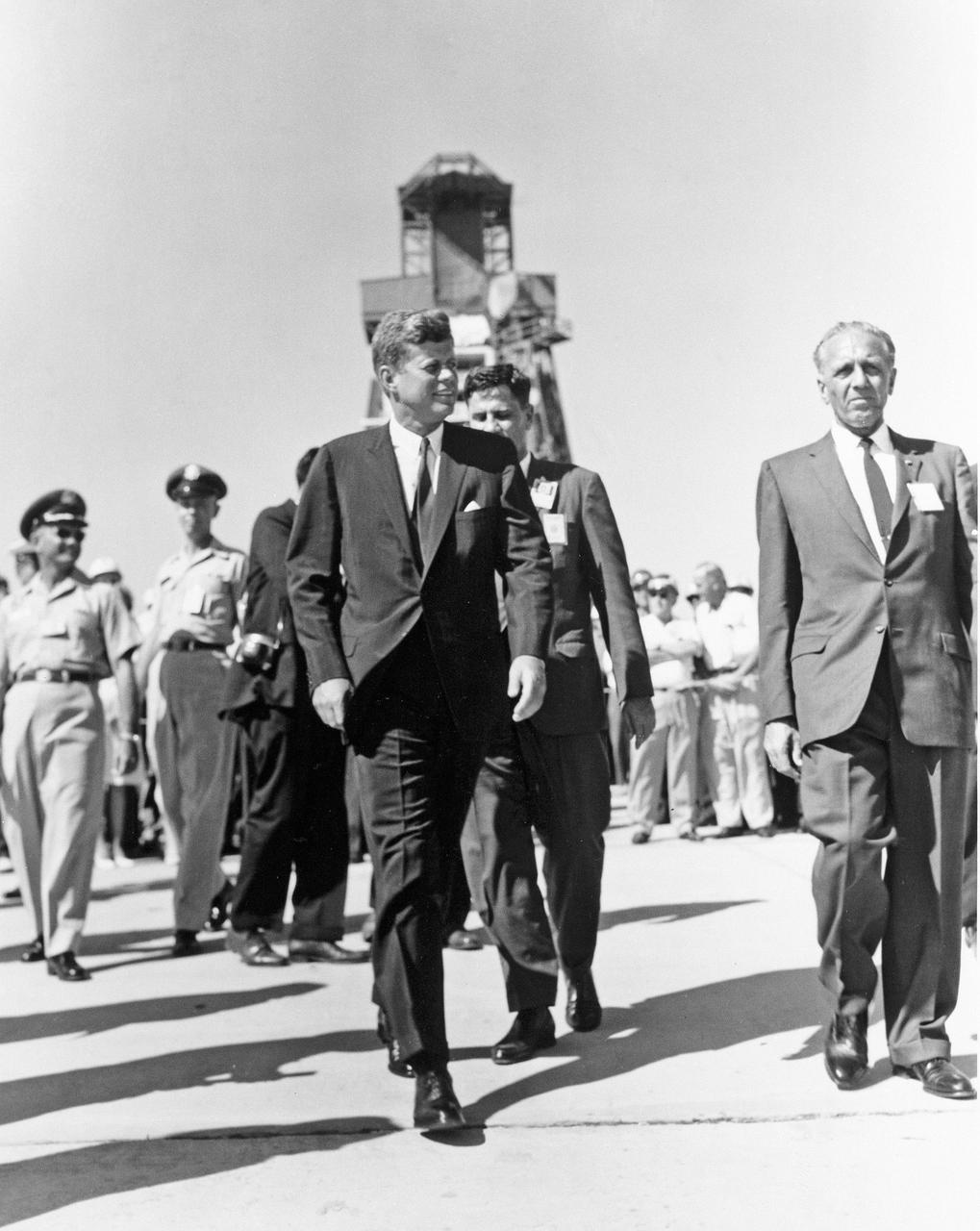 CAPE CANAVERAL Fla. -- President John F. Kennedy is escorted by Launch Operations Center Director Dr. Kurt H. Debus, on the right, on a tour of Launch Complex-14 at the Cape Canaveral Missile Test Annex in Florida. Photo Credit: NASA