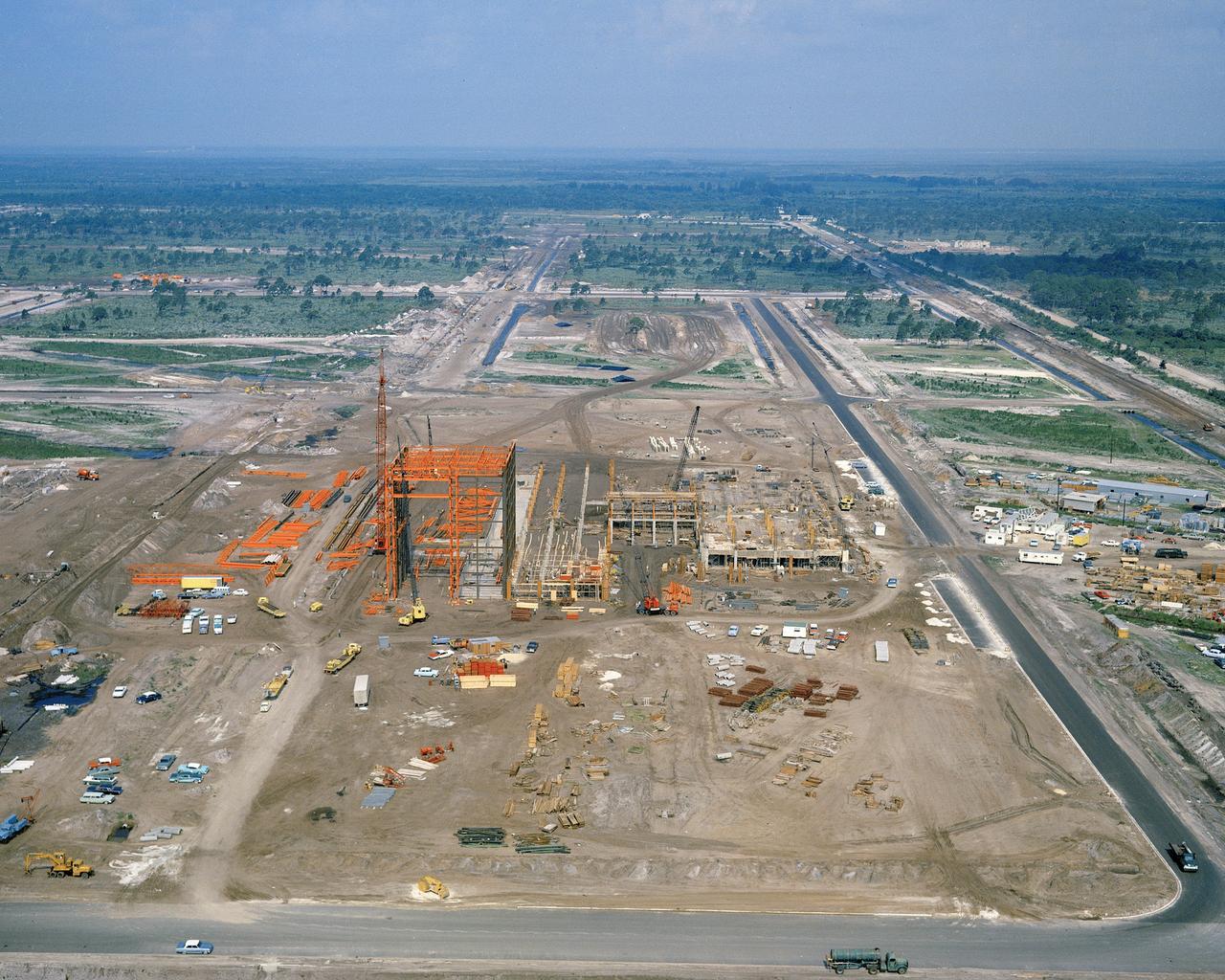 CAPE CANAVERAL Fla. -- This aerial view shows construction progress of the Manned Spacecraft Operations Building at NASA's Merritt Island Launch Annex. Photo Credit: NASA