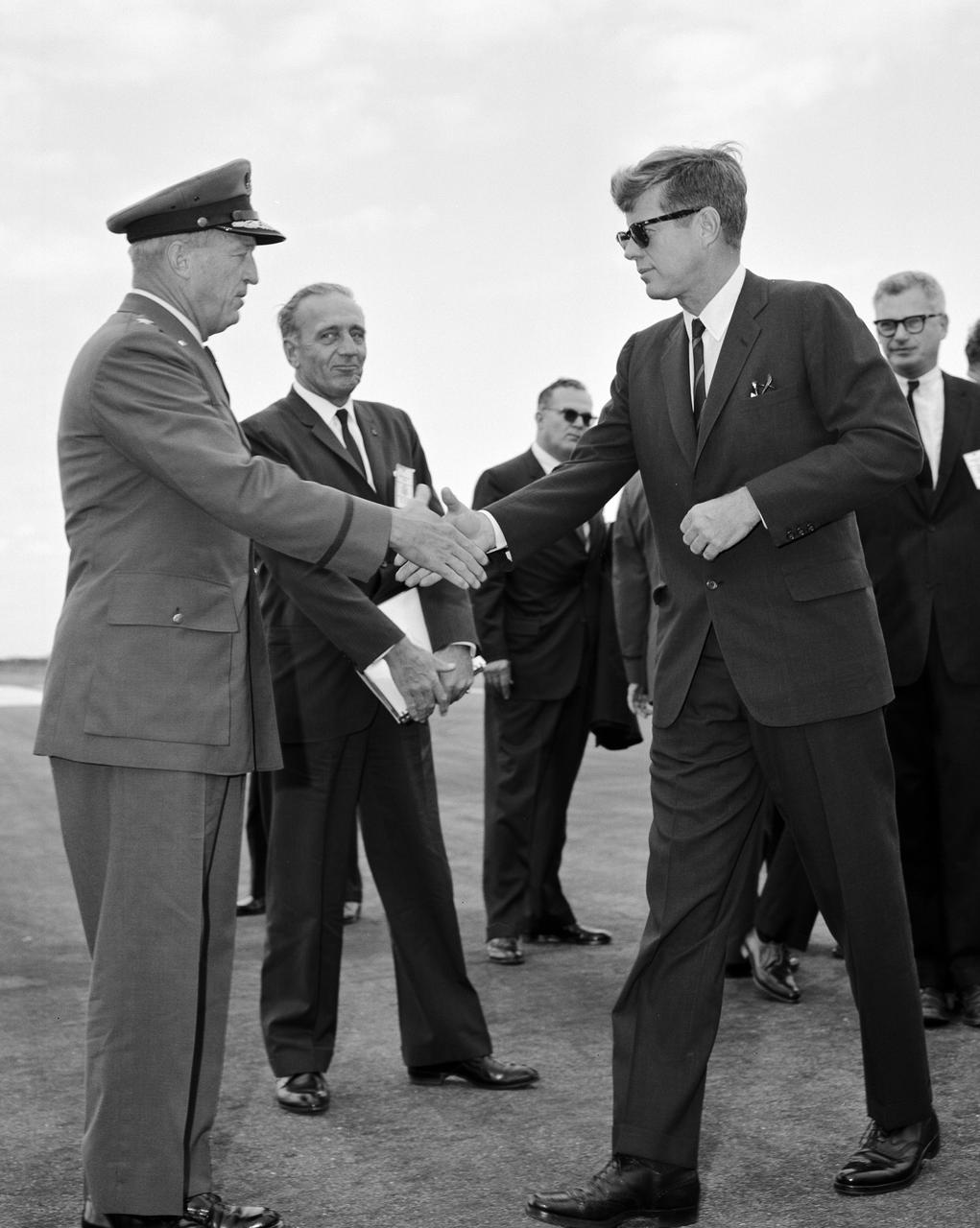 CAPE CANAVERAL Fla. -- Maj. Gen. L. I. Davis, commander of the U.S. Air Force Missile Test Center, welcomes President John F. Kennedy to the Cape Canaveral Missile Test Annex in Florida. Photo Credit: NASA