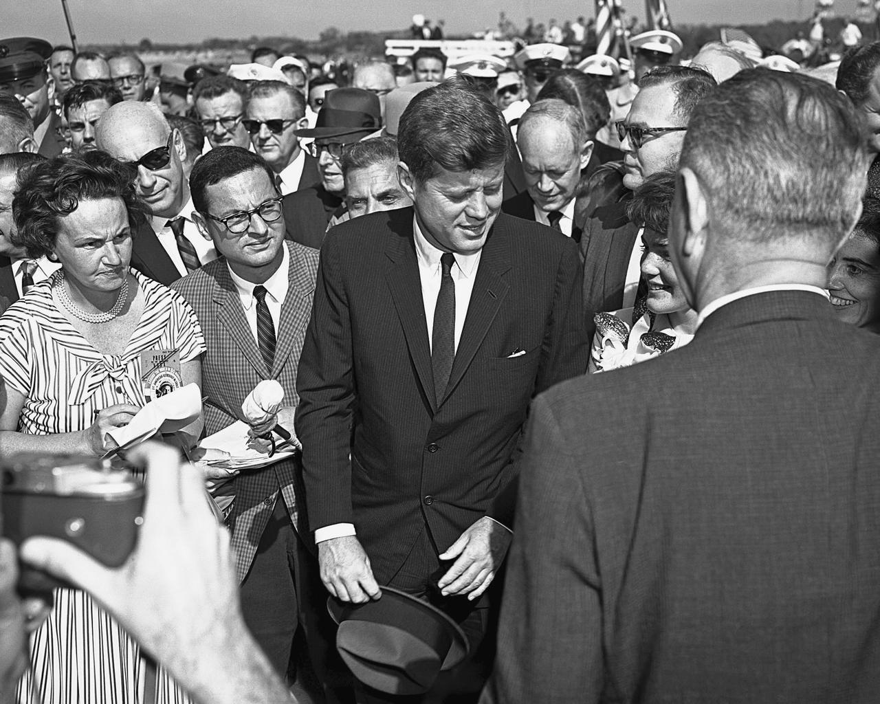 CAPE CANAVERAL, Fla. -- President John F. Kennedy honors John H. Glenn Jr. during welcome-back ceremonies at Patrick Air Force Base and Cape Canaveral in Florida after his historic three-orbit mission aboard Friendship 7. Vice President Lyndon B. Johnson also is in attendance, with his back to the camera. Photo credit: NASA