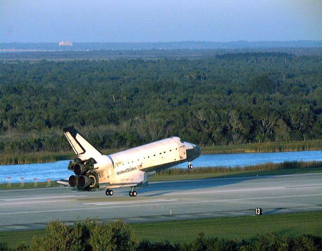 With Commander Kevin Kregel and Pilot Steven Lindsey at the controls, the orbiter Columbia glides moments before its touchdown on Runway 33 at KSC’s Shuttle Landing Facility. Main gear touchdown occurred at 7:20:04 a.m. EST on Dec. 5 to complete the 15-day, 16-hour and 34-minute-long STS-87 mission of 6.5 million miles. Also onboard the orbiter are Mission Specialists Winston Scott; Kalpana Chawla, Ph.D.; and Takao Doi, Ph.D., of the National Space Development Agency of Japan; along with Payload Specialist Leonid Kadenyuk of the National Space Agency of Ukraine. During the 88th Space Shuttle mission, the crew performed experiments on the United States Microgravity Payload-4 and pollinated plants as part of the Collaborative Ukrainian Experiment. This was the 12th landing for Columbia at KSC and the 41st KSC landing in the history of the Space Shuttle program