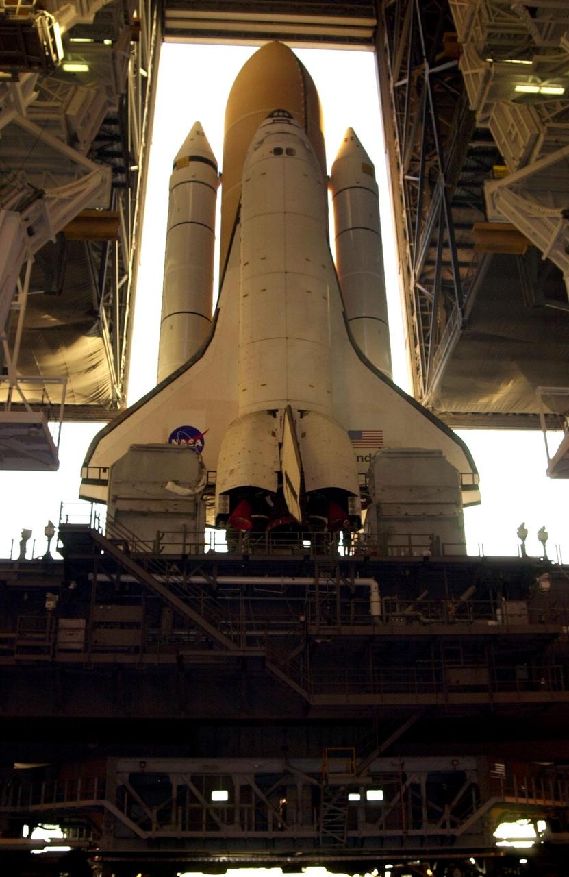 KENNEDY SPACE CENTER, Fla. -- With the early morning light behind it, Space Shuttle Endeavour appears to fill the opening in the Vehicle Assembly Building as it begins rollout to Launch Pad 39B on the Mobile Launcher Platform (MLP). At the bottom can be seen the crawler-transporter that moves the combined Shuttle and MLP. Endeavour is scheduled to be launched Nov. 30 at 10:01 p.m. EST on mission STS-97, the sixth construction flight to the International Space Station. Its payload includes the P6 Integrated Truss Structure and a photovoltaic (PV) module, with giant solar arrays that will provide power to the Station. The mission includes two spacewalks to complete the solar array connections