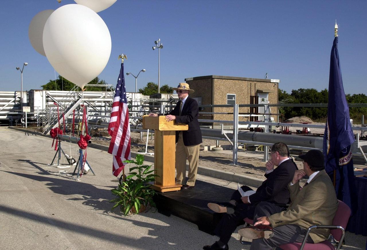Center Director Roy Bridges addresses the audience at the commissioning of a new high-pressure helium pipeline at Kennedy Space Center that will service launch needs at the new Delta IV Complex 37 at Cape Canaveral Air Force Station. The nine-mile-long buried pipeline will also serve as a backup helium resource for Shuttle launches. Nearly one launch’s worth of helium will be available in the pipeline to support a Shuttle pad in an emergency. The line originates at the Helium Facility on KSC and terminates in a meter station at the perimeter of the Delta IV launch pad. Others at the ceremony were Jerry Jorgensen, pipeline project manager, Space Gateway Support (SGS); Col. Samuel Dick, representative of the 45th Space Wing; Ramon Lugo, acting executive director, JPMO; David Herst, director, Delta IV Launch Sites; Pierre Dufour, president and CEO, Air Liquide America Corporation; and Michael Butchko, president, SGS