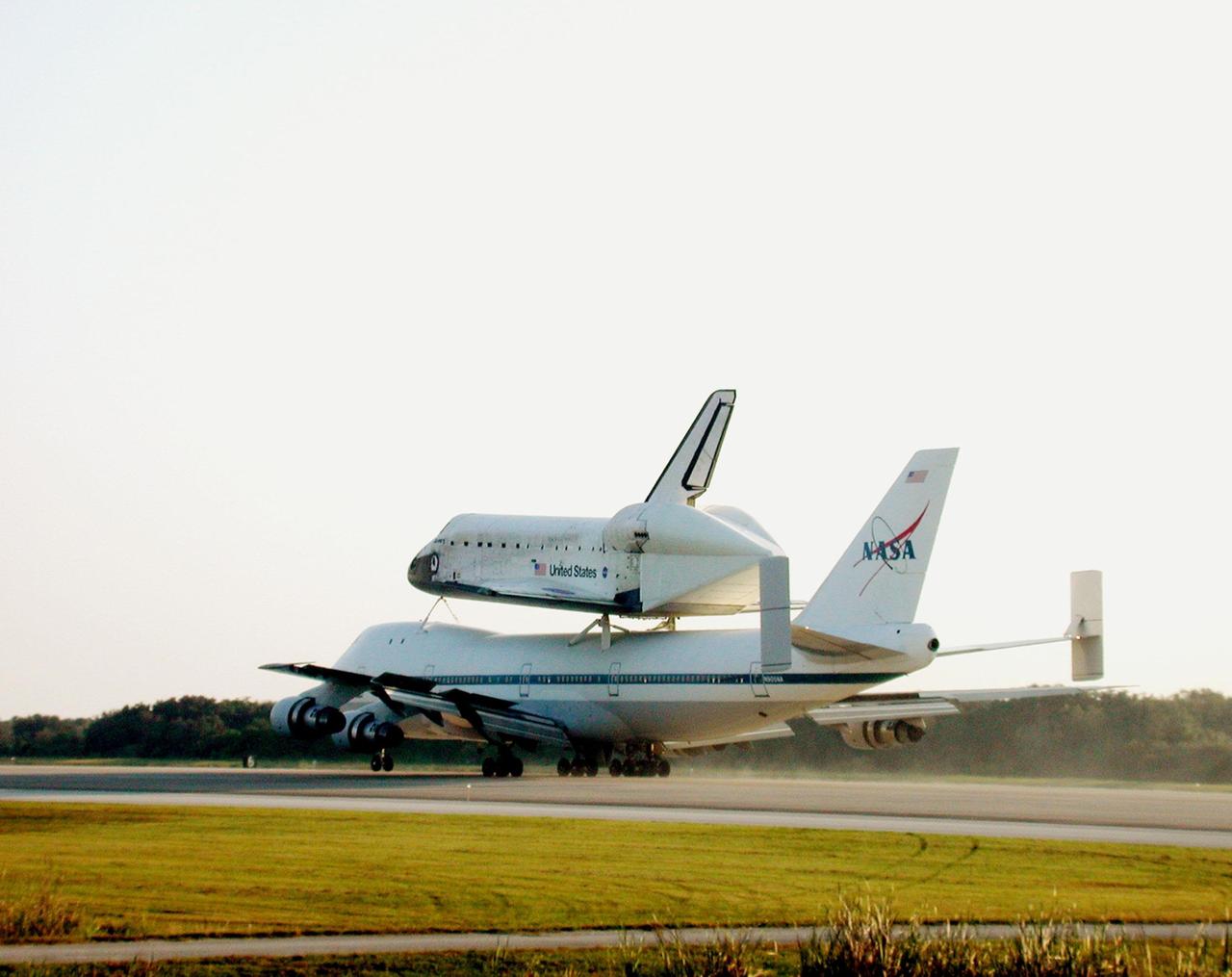 In late afternoon, the Shuttle Carrier Aircraft (SCA) rolls down the runway at the Shuttle Landing Facility as it returns the orbiter Discovery to KSC. The ferry flight started in California where the orbiter landed more than a week ago at Edwards Air Force Base at the end of mission STS-92. Discovery wears a tail cone protecting its aft nozzles for the ferry flight. Discovery will be demated from the SCA via the mate/demate device at the SLF and transported to the Orbiter Processing Facility bay 1. There it will undergo preparations for its next launch, STS-102, scheduled for February 2001