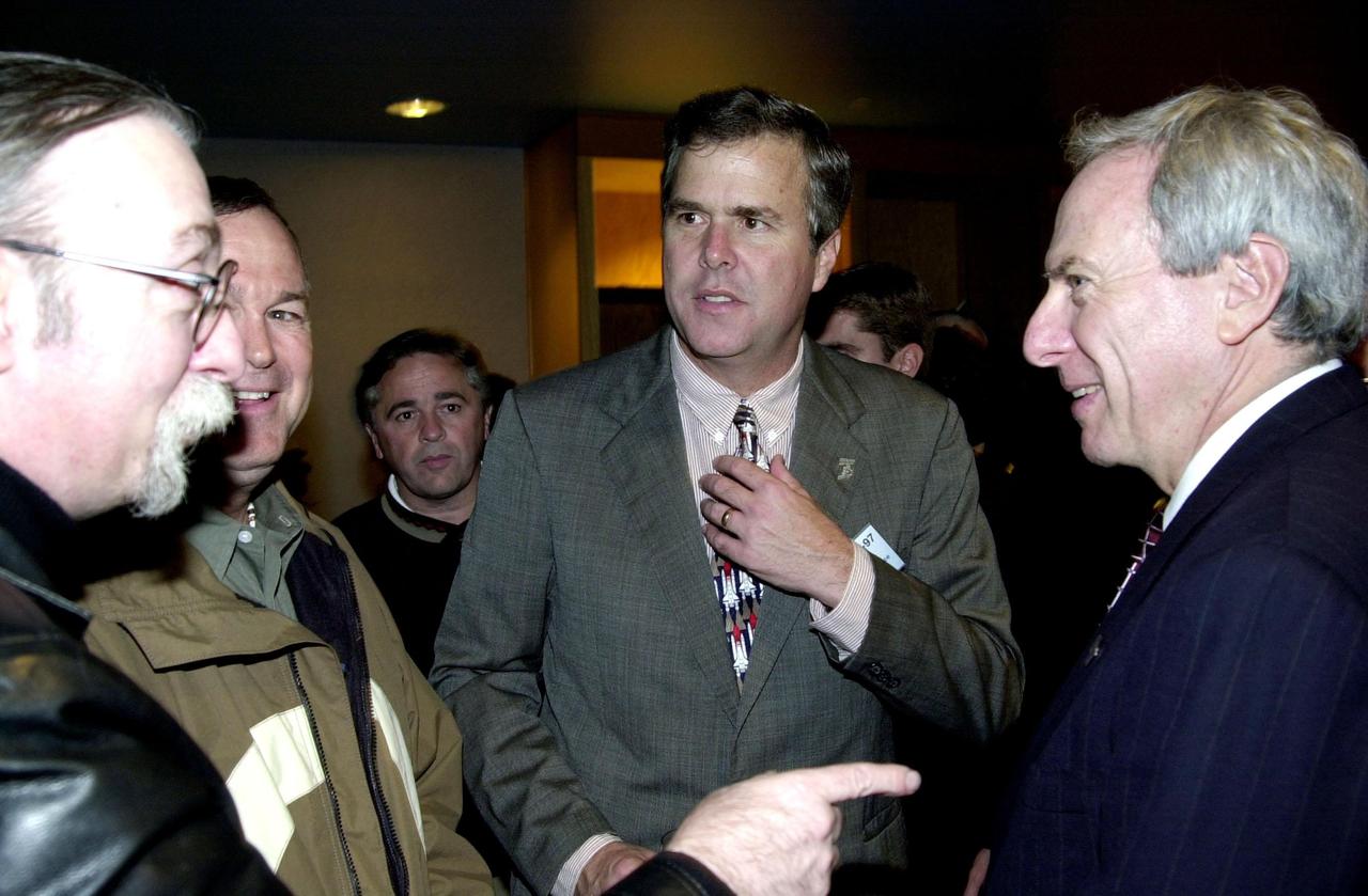KENNEDY SPACE CENTER, FLA. -- Florida’s Governor Jeb Bush (center) joins NASA Administrator Daniel Goldin (right) for the launch of Space Shuttle Endeavour on mission STS-97. They viewed the launch from the Banana Creek VIP Site. Liftoff of Endeavour occurred on time at 10:06:01 p.m. EST with a crew of five. The sixth construction flight to the International Space Station, Endeavour is transporting the P6 Integrated Truss Structure that comprises Solar Array Wing-3 and the Integrated Electronic Assembly, to provide power to the Space Station. The 11-day mission includes two spacewalks to complete the solar array connections. Endeavour is expected to land Dec. 11 at 6:19 p.m. EST