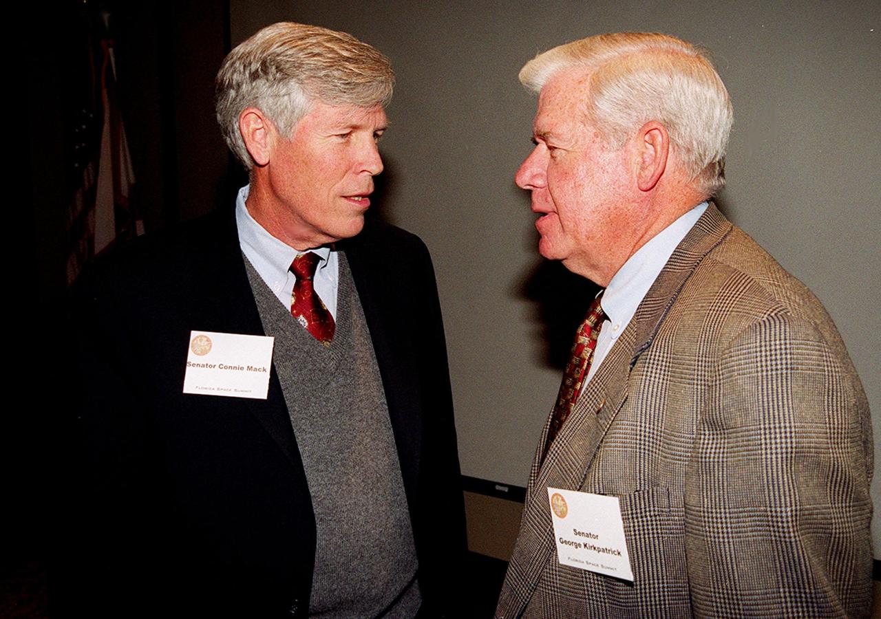 Senator Connie Mack and Senator George Kirkpatrick talk before the Florida Space Summit being held today at the Kennedy Space Center Visitor Complex. The event, featuring a discussion on the future of space as it relates to the State of Florida and moderated by Center Director Roy Bridges, included participants such as Senator Bob Graham, Rep. Dave Weldon, members of Florida's State government including Gov. Jeb Bush, NASA Administrator Dan Goldin, 45th Space Wing Commander Brig. Gen. Donald Pettit and heads of aerospace companies