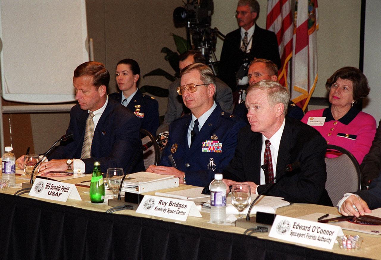 Taking part in the First Florida Space Summit on the future of space as it relates to the State of Florida are (left to right) Lt. Governor Frank Brogan, 45th Space Wing Commander Brig. Gen. Donald Pettit, and Center Director Roy Bridges, who moderated the discussion. The event, held at the Kennedy Space Center Visitor Complex, also included Senator Bob Graham, Senator Connie Mack, State Senator Patsy Kurth, Representative Dave Weldon, and heads of aerospace companies
