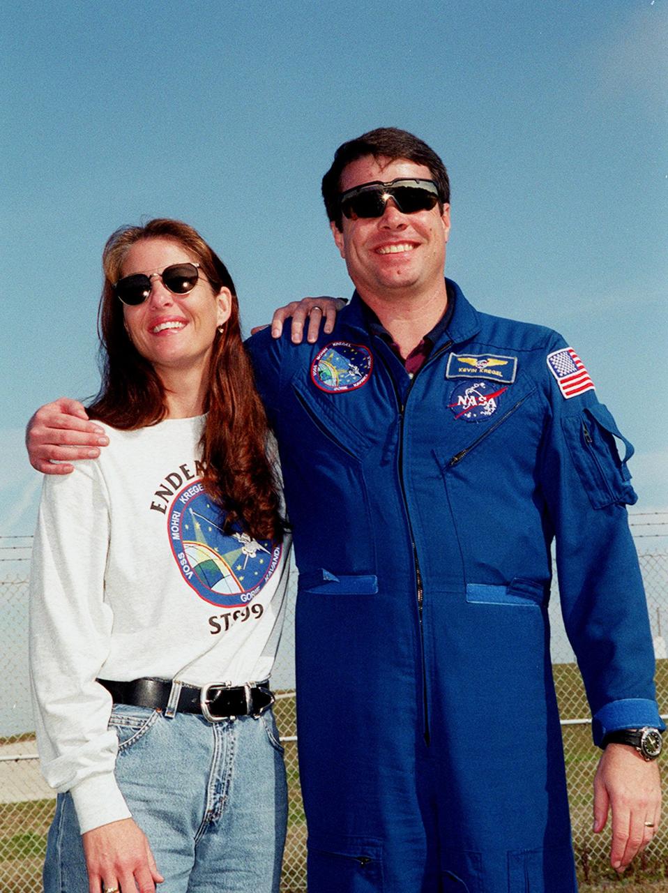 KENNEDY SPACE CENTER, Fla. -- The day before the expected launch of STS-99, Commander Kevin Kregel enjoys a reunion with his wife, Jeanne, near Launch Pad 39A where family and friends have gathered to greet the crew. STS-99, known as the Shuttle Radar Topography Mission (SRTM), is scheduled to lift off 12:47 p.m. EST from Launch Pad 39A. The SRTM will chart a new course to produce unrivaled 3-D images of the Earth's surface, using two antennae and a 200-foot-long section of space station-derived mast protruding from the payload bay. The result of the Shuttle Radar Topography Mission could be close to 1 trillion measurements of the Earth's topography. Besides contributing to the production of better maps, these measurements could lead to improved water drainage modeling, more realistic flight simulators, better locations for cell phone towers, and enhanced navigation safety. The mission is expected to last about 11days, with Endeavour landing at KSC Friday, Feb. 11, at 4:55 p.m