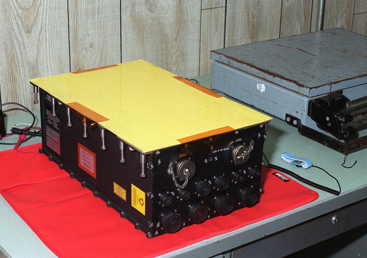 KENNEDY SPACE CENTER, FLA. -- A new Enhanced Main Events Controller (E-MEC) for Shuttle Endeavour sits on a table in a Quality trailer in the Launch Pad 39B area. The original E-MEC in Endeavour became suspect during the Jan. 31 launch countdown and mission STS-99 was delayed when NASA managers decided to replace it. Each Shuttle carries two enhanced master events controllers (E-MECs), which provide relays for onboard flight computers to send signals to arm and fire pyrotechnics that separate the solid rockets and external tank during assent. The E-MECs are located in the orbiter's aft compartment and both are needed for the Shuttle to be cleared for flight. Currently Endeavour and Columbia are the only two orbiters with the E-MECs. Built by Rockwell's Satellite Space Electronics Division, Anaheim, Calif., each unit weighs 65 pounds and is approximately 20 inches long, 13 inches wide and 8 inches tall. Previously, three Shuttle flights have been scrubbed or delayed due to faulty MECs: STS-73, STS-49 and STS-41-D. Before workers can begin E-MEC replacement efforts at the launch pad, cryogenic reactants must be offloaded from the orbiter and Space Shuttle ordnance disconnected. The next scheduled date for launch of STS-99 is Feb. 11 at 12:30 p.m. EST