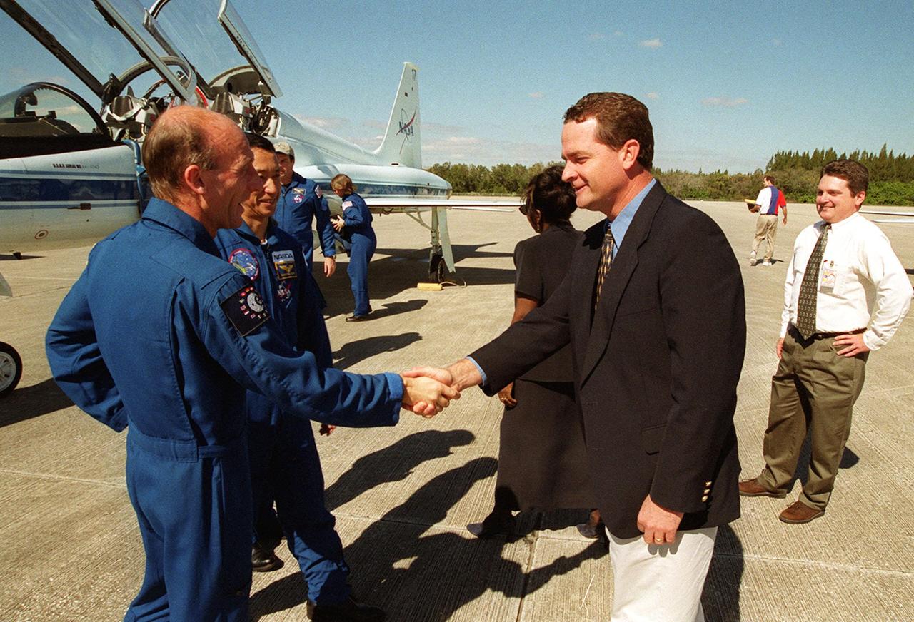 After landing at the Shuttle Landing Facility aboard T-38 jet aircraft, STS-99 Mission Specialists (from left) Gerhard Thiele of Germany and Mamoru Mohri of Japan are greeted by Dave King, director of Shuttle Operations. Behind Mohri can be seen Commander Kevin Kregel and Mission Specialist Janice Voss. The crew, which includes Pilot Dom gorie and Mission Specialist Janet Kavandi, are ready to prepare for the second launch attempt of Endeavour Feb. 11 at 12:30 p.m. EST from Launch Pad 39A. The earlier launch scheduled for Jan. 31 was scrubbed due to poor weather and a faulty Enhanced Master Events Controller in the orbiter's aft compartment. Over the next few days, the crew will review mission procedures, conduct test flights in the Shuttle Training Aircraft and undergo routine preflight medical exams. STS-99 is the Shuttle Radar Topography Mission, which will produce unrivaled 3-D images of the Earth's surface. The result of the Shuttle Radar Topography Mission could be close to 1 trillion measurements of the Earth's topography. Landing is expected at KSC on Feb. 22 at 4:36 p.m. EST