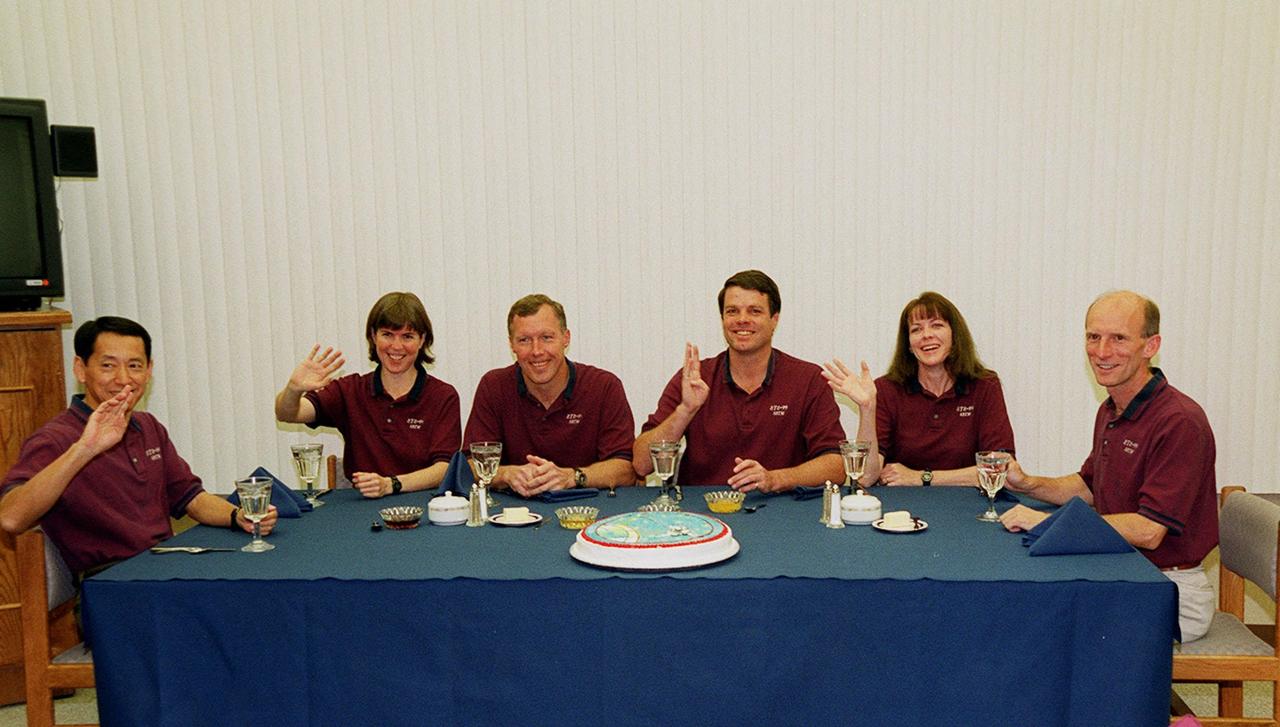 In the Operations and Checkout Building, an eager and smiling STS-99 crew gathers for breakfast before suiting up for launch. From left are Mission Specialists Mamoru Mohri and Janice Voss, Pilot Dominic Gorie, Commander Kevin Kregel, and Mission Specialists Janet Lynn Kavandi and Gerhard Thiele. Mohri is with the National Space Development Agency (NASDA) of Japan, and Thiele is with the European Space Agency. Known as the Shuttle Radar Topography Mission (SRTM), STS-99 is scheduled for liftoff at 12:30 p.m. EST from Launch Pad 39A. The SRTM will chart a new course to produce unrivaled 3-D images of the Earth's surface. The result of the Shuttle Radar Topography Mission could be close to 1 trillion measurements of the Earth's topography. The mission is expected to last about 11days, with Endeavour landing at KSC Tuesday, Feb. 22, at 4:36 p.m. EST. This is the 97th Shuttle flight and 14th for Shuttle Endeavour
