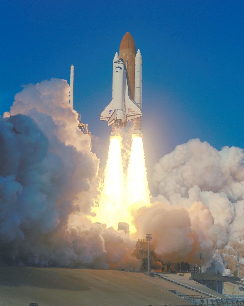 KENNEDY SPACE CENTER, Fla. -- Twin columns of flame flow from the solid rocket boosters, lighting the billows of steam behind them with an orange glow, as Space Shuttle Endeavour roars into space on mission STS-99. Liftoff occurred at 12:43:40 p.m. EST. Known as the Shuttle Radar Topography Mission (SRTM), STS-99 will chart a new course to produce unrivaled 3-D images of the Earth's surface. The result of the SRTM could be close to 1 trillion measurements of the Earth's topography. The mission is expected to last 11days, with Endeavour landing at KSC Tuesday, Feb. 22, at 4:36 p.m. EST. This is the 97th Shuttle flight and 14th for Shuttle Endeavour