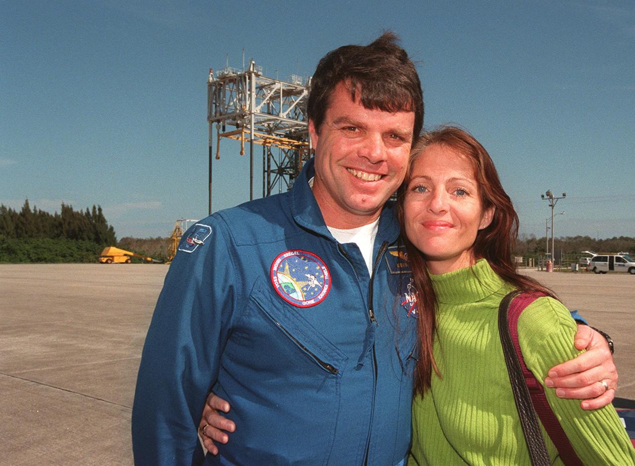 At the Shuttle Landing Facility, STS-99 Commander Kevin Kregel is joined by his wife, Jeanne, before their departure for Houston. The STS-99 crew completed a successful 11-day Shuttle Radar Topography Mission mapping 47 million square miles of the Earth's surface before landing at KSC Feb. 22