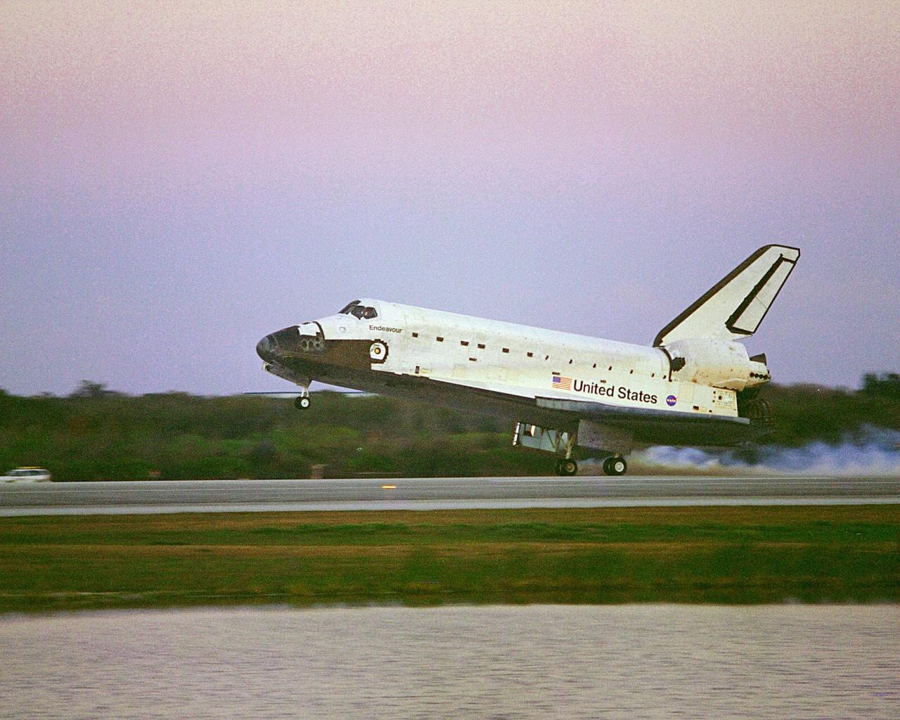 KENNEDY SPACE CENTER, FLA. -- In the waning light after sundown, Space Shuttle Endeavour touches down on KSC's Shuttle Landing Facility Runway 33 to complete the 11-day, 5-hour, 38-minute-long STS-99 mission. At the controls are Commander Kevin Kregel and Pilot Dominic Gorie. Also onboard the orbiter are Mission Specialists Janet Kavandi, Janice Voss, Mamoru Mohri of Japan and Gerhard Thiele of Germany. Mohri is with the National Space Development Agency (NASDA) and Thiele is with the European Space Agency. The crew are returning from the Shuttle Radar Topography Mission after mapping more than 47 million square miles of the Earth's surface. Main gear touchdown was at 6:22:23 p.m. EST Feb. 22 , landing on orbit 181 of the mission. Nose gear touchdown was at 6:22:35 p.m.. EST, and wheel stop at 6:23:25 p.m. EST. This was the 97th flight in the Space Shuttle program and the 14th for Endeavour, also marking the 50th landing at KSC, the 21st consecutive landing at KSC, and the 28th in the last 29 Shuttle flight