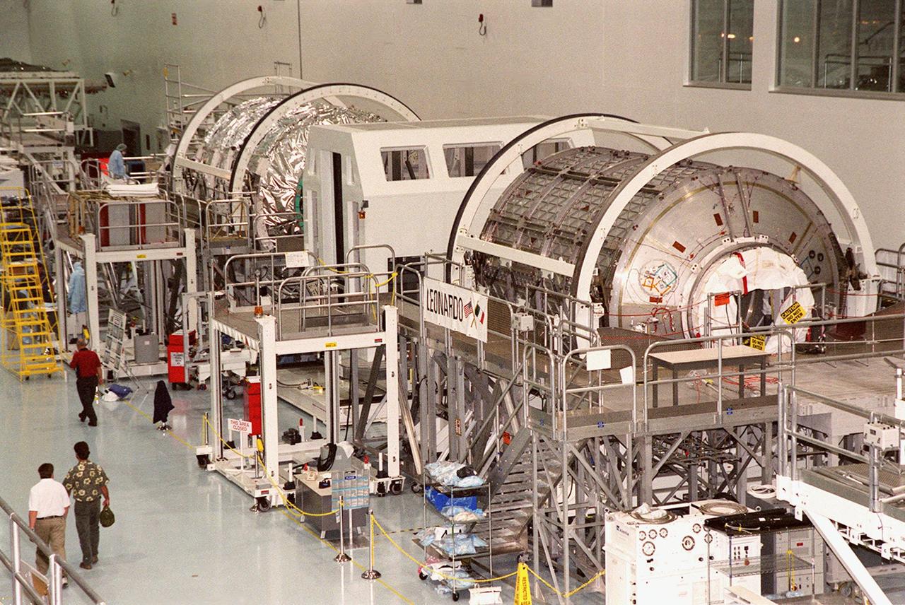KENNEDY SPACE CENTER, FLA. -- Inside the Space Station Processing Facility, two Multi-Purpose Logistics Modules, Italian-built Raffaello and Leonardo, undergo testing. Italy's major contributions to the International Space Station program, Raffaello and Leonardo are reusable logistics carriers to resupply and return Space Station cargo requiring a pressurized environment. They are slated as payloads on missions STS-102 and STS-100, respectively. Dates have not yet been determined for the two missions