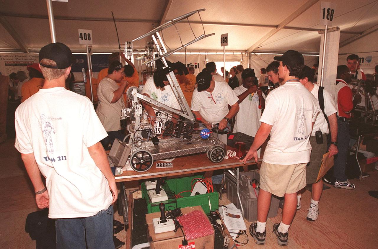 Students from high schools around the United States busily prepare their robots for the FIRST (For Inspiration and Recognition of Science and Technology) Southeast Regional competition March 9-11 at the KSC Visitor Complex. In the front is a team called Lightning, from Dr. Michael M. Krop Senior High School in Miami, Fla. Teams of high school students are testing the limits of their imagination using robots they have designed, with the support of business and engineering professionals and corporate sponsors, to compete in a technological battle against other schools' robots. Of the 30 high school teams competing at KSC, 16 are Florida teams co-sponsored by NASA and KSC contractors. Local high schools participating are Astronaut, Bayside, Cocoa Beach, Eau Gallie, Melbourne, Melbourne Central Catholic, Palm Bay, Rockledge, Satellite, and Titusville