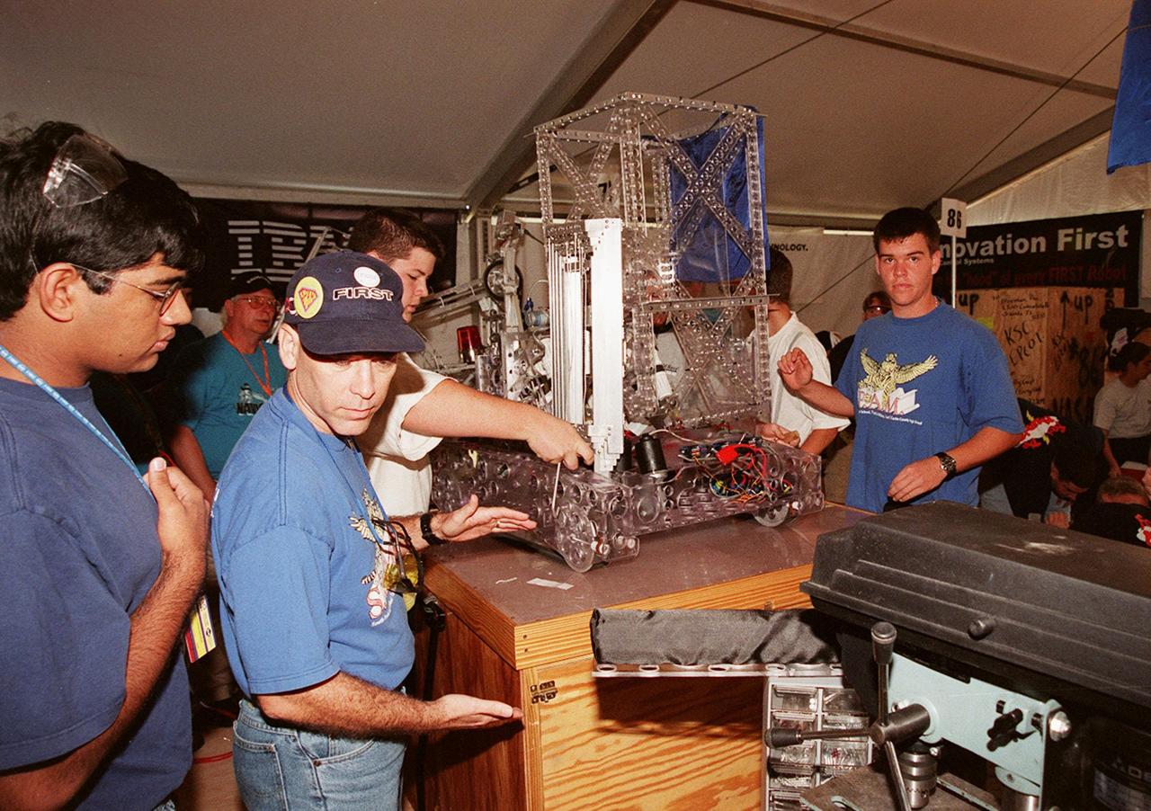 Students from high schools around the United States busily prepare their robots for the FIRST (For Inspiration and Recognition of Science and Technology) Southeast Regional competition March 9-11 at the KSC Visitor Complex. Teams of high school students are testing the limits of their imagination using robots they have designed, with the support of business and engineering professionals and corporate sponsors, to compete in a technological battle against other schools' robots. Of the 30 high school teams competing at KSC, 16 are Florida teams co-sponsored by NASA and KSC contractors. Local high schools participating are Astronaut, Bayside, Cocoa Beach, Eau Gallie, Melbourne, Melbourne Central Catholic, Palm Bay, Rockledge, Satellite, and Titusville