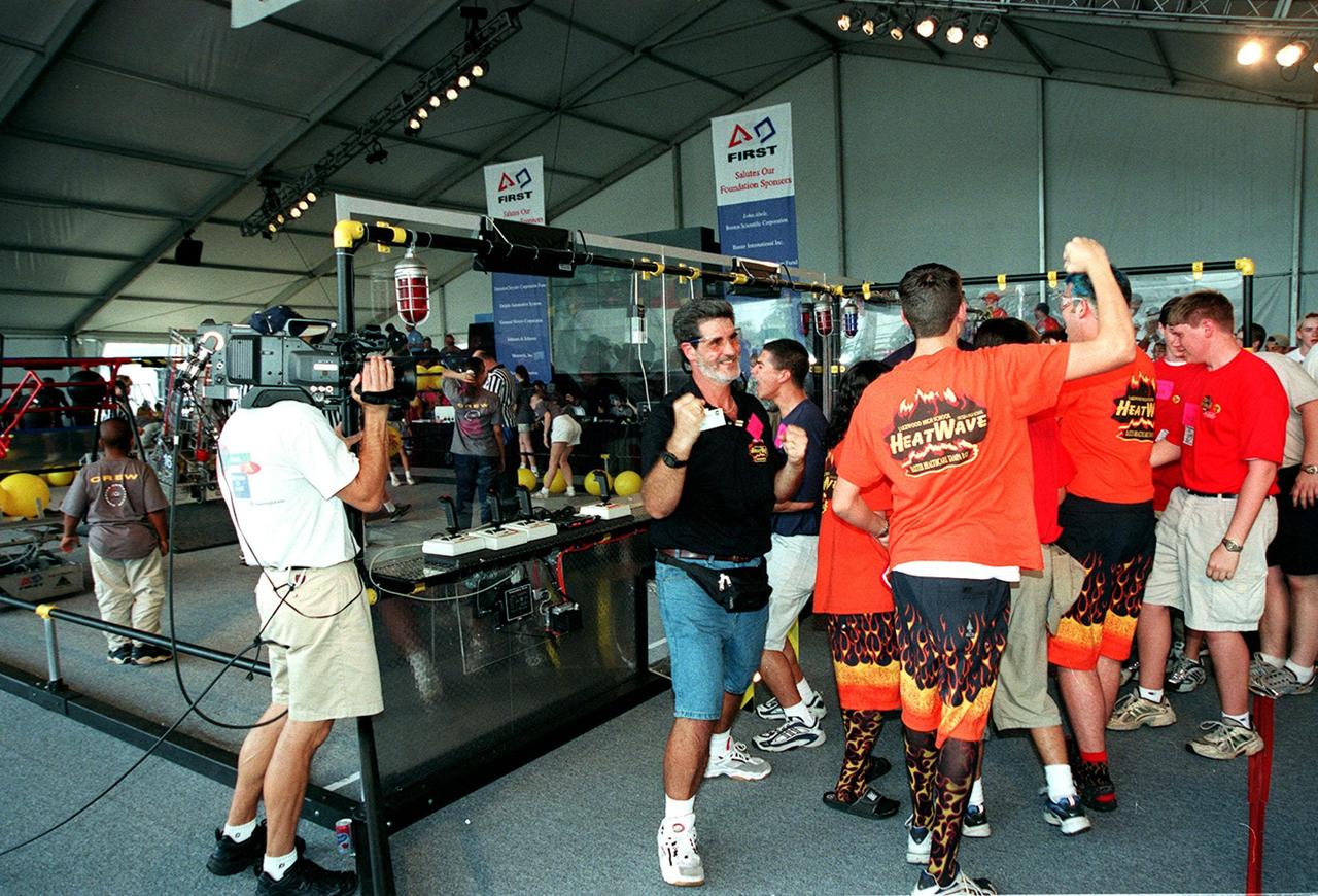 The team known as Heatwave, from St. Petersburg, Fla., celebrates after their win at the FIRST (For Inspiration and Recognition of Science and Technology) Southeast Regional competition held at the KSC Visitor Complex. They came in second for the final competition, plus received awards for Number One Seed, Best Offensive round, and the DaimlerChrysler Team Spirit. Teams of high school students from all over the country tested the limits of their imagination using robots they designed, with the support of business and engineering professionals and corporate sponsors, to compete in a technological battle against other schools' robots. Of the 30 high school teams competing at the Southeast Regional event, 16 were Florida teams co-sponsored by NASA and KSC contractors. Local high schools participating are Astronaut, Bayside, Cocoa Beach, Eau Gallie, Melbourne, Melbourne Central Catholic, Palm Bay, Rockledge, Satellite, and Titusville