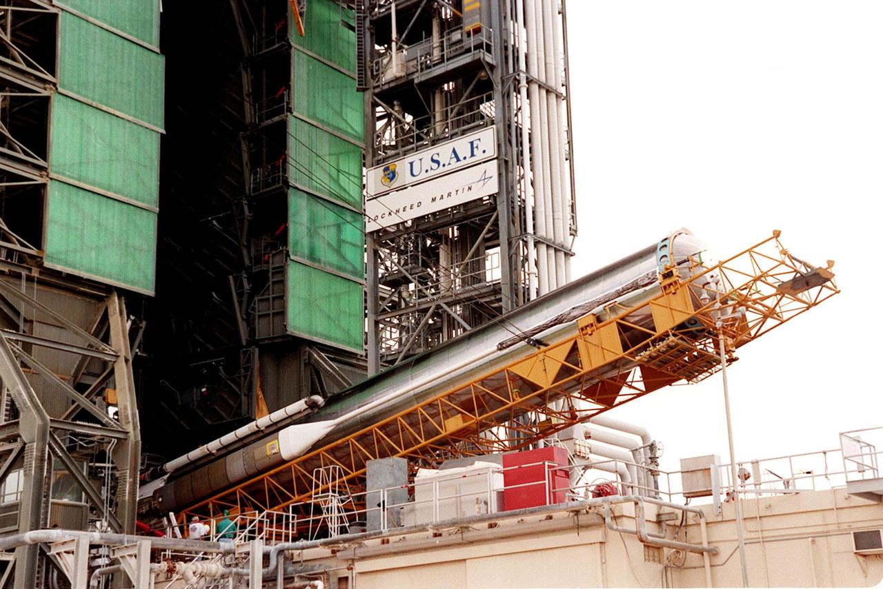At Cape Canaveral Air Force Station, the first stage of an Atlas II/Centaur rocket begins erection in the launch gantry on pad 36A. Atlas II is designed to launch payloads into low earth orbit, geosynchronous transfer orbit or geosynchronous orbit. The rocket is the launch vehicle for the NASA/Lockheed Martin GOES-L satellite, part of the NOAA National Weather Service system in weather imagery and atmospheric sounding information. The primary objective of the GOES-L is to provide a full capability satellite in an on-orbit storage condition, to assure NOAA continuity in services from a two-satellite constellation. Launch services are being provided by the 45th Space Wing