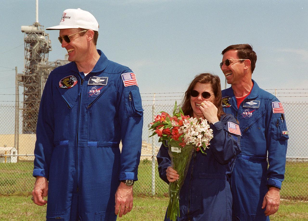 KENNEDY SPACE CENTER, FLA. -- A light-hearted moment during a meeting of the STS-101 crew with family and friends at Launch Pad 39A. From left are Commander James D. Halsell Jr., Mission Specialist Mary Ellen Weber and Pilot Scott J. Horowitz. Mission STS-101 will take the crew to the International Space Station to deliver logistics and supplies, plus prepare the Station for the arrival of the Zvezda Service Module, expected to be launched by Russia in July 2000. The crew will conduct one spacewalk to perform maintenance on the Space Station as well. This will be the third assembly flight for the Space Station. Launch is targeted for April 24 at about 4:15 p.m. EDT from Launch Pad 39A.