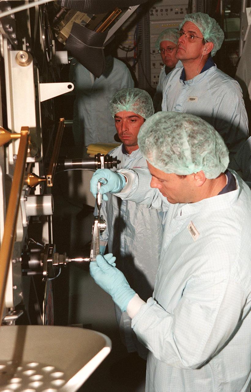 KENNEDY SPACE CENTER, FLA. -- In the Space Station Processing Facility, members of the STS-92 crew get hands-on experience with some of the equipment, such as the Integrated Truss Structure Z1, to fly on their mission. STS-92 is the fifth U.S. flight in the construction of the International Space Station. The Z1 is an early exterior framework to allow the first U.S. solar arrays on a future flight to be temporarily installed on Unity for early power. Another part of the payload is a pressurized mating adapter, PMA-3, to provide a Shuttle docking port for solar array installation on the sixth ISS flight and Lab installation on the seventh ISS flight. The crew comprises Mission Commander Brian Duffy, Pilot Pamela A. Melroy, and Mission Specialists Koichi Wakata, Leroy Chiao, Peter J.K. Wisoff, Michael E. Lopez-Alegria, and William S. McArthur Jr. Wakata is with the National Space Development Agency of Japan. Launch of STS-92 is scheduled for Sept. 21, 2000