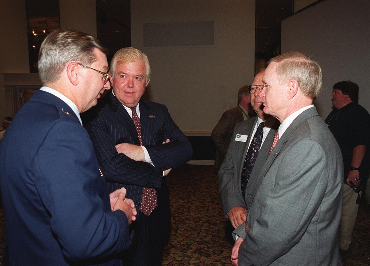 Space Congress attendees network. From left are Brig. Gen. Donald Pettit, commander of the 45th Space Wing; Lou Dobbs, chief executive officer of Space.com; Charles Murphy, Space Congress general chairman; and Roy Bridges Jr., Kennedy Space Center director. The 37th Space Congress, sponsored by the Canaveral Council of Technical Societies, featured the theme &quot;Space Means Business in the 21st Century.&quot; The event was held at the Radisson Resort at the Port in Cape Canaveral