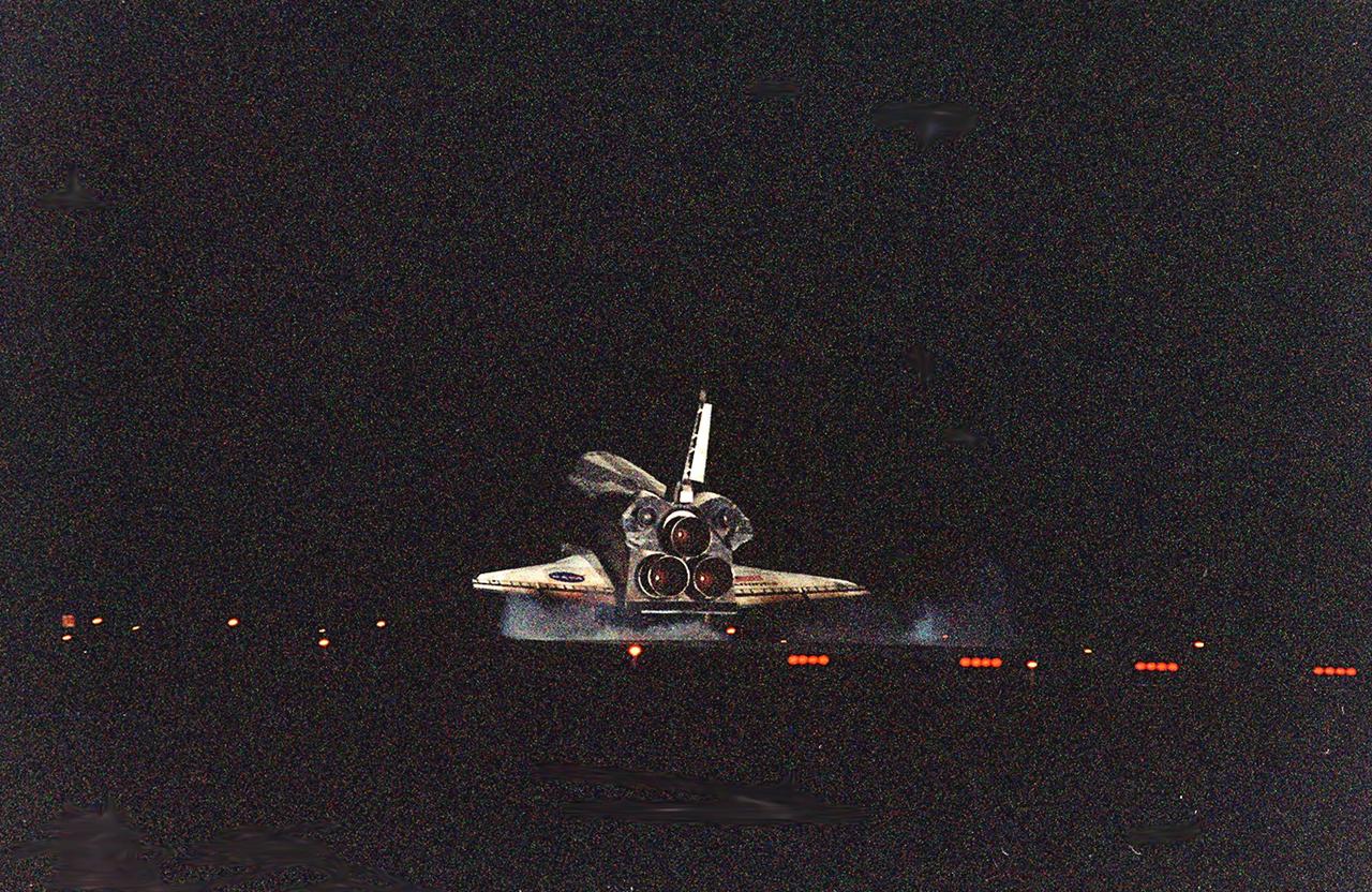 KENNEDY SPACE CENTER, Fla. -- Smoke swirls up from Runway 15 as Space Shuttle Atlantis’ wheels touch down, completing the 9-day, 20-hour, 9-minute-long STS-101 mission. At the controls are Commander James D. Halsell Jr. and Pilot Scott “Doc” Horowitz. Also onboard the orbiter are Mission Specialists Mary Ellen Weber, James S. Voss, Jeffrey N. Williams, Susan J. Helms and Yury Usachev of Russia. The crew is returning from the third flight to the International Space Station. This was the 98th flight in the Space Shuttle program and the 21st for Atlantis, also marking the 51st landing at KSC, the 22nd consecutive landing at KSC, the 14th nighttime landing in Shuttle history and the 29th in the last 30 Shuttle flights. Main gear touchdown was at 2:20:17 a.m. EDT May 29 , landing on orbit 155 of the mission. Nose gear touchdown was at 2:20:30 a.m. EDT, and wheel stop at 2:21:19 a.m. EDT