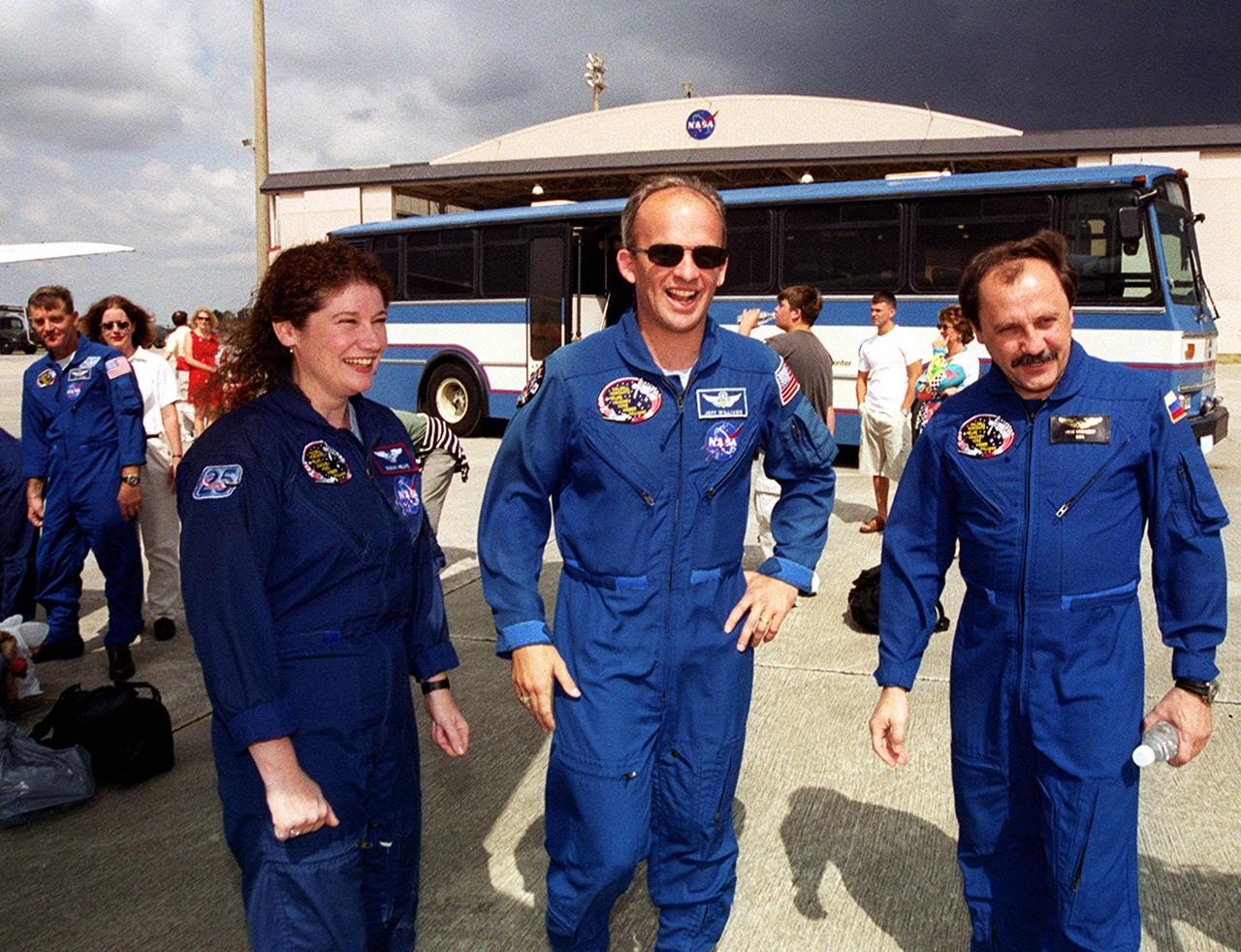 Members of the STS-101 crew gather with families and friends at Patrick Air Force Base before departure for Houston. In the foreground are Mission Specialists Susan J. Helms, Jeffrey N. Williams and Yury Usachev of Russia. At far left is Mission Specialist James S. Voss. After landing at 2:20 a.m. EDT May 29, the crew and their families enjoyed the Memorial Day holiday in Florida. The crew returned from the third flight to the International Space Station where they made repairs, transferred cargo and completed a space walk to install and connect several pieces of equipment on the outside of the Space Station