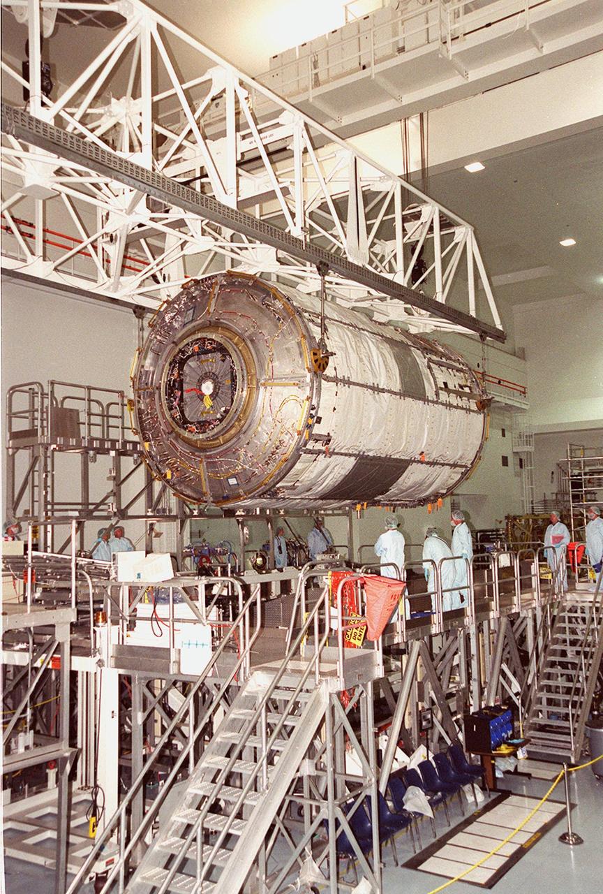 KENNEDY SPACE CENTER, FLA. -- In the Space Station Processing Facility, an overhead crane lifts and moves the U.S. Laboratory Destiny to a weigh stand. A component of the International Space Station, Destiny is scheduled to fly on mission STS-98 in early 2001. During the mission, the crew will install the Lab during a series of three space walks. The STS-98 mission will provide the station with science research facilities and expand its power, life support and control capabilities. The U.S. Lab module continues a long tradition of microgravity materials research, first conducted by Skylab and later Shuttle and Spacelab missions. Destiny is expected to be a major feature in future research, providing facilities for biotechnology, fluid physics, combustion, and life sciences research