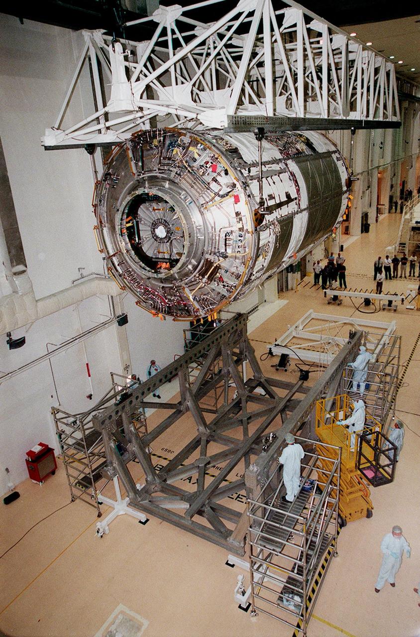 KENNEDY SPACE CENTER, FLA. -- In the Operations and Checkout Building, the U.S. Lab, named Destiny, is moved to the rotation and handling fixture in preparation for testing in the altitude chamber. Destiny is scheduled to fly on mission STS-98 in early 2001. During the mission, the crew will install the Lab in the Space Station during a series of three space walks. The STS-98 mission will provide the Station with science research facilities and expand its power, life support and control capabilities. The U.S. Lab module continues a long tradition of microgravity materials research, first conducted by Skylab and later Shuttle and Spacelab missions. Destiny is expected to be a major feature in future research, providing facilities for biotechnology, fluid physics, combustion, and life sciences research