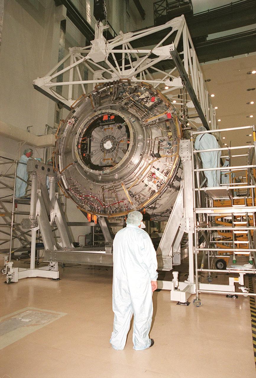 KENNEDY SPACE CENTER, FLA. -- In the Operations and Checkout Building, the U.S. Lab, named Destiny, is lowered into the rotation and handling fixture in preparation for testing in the altitude chamber. Destiny is scheduled to fly on mission STS-98 in early 2001. During the mission, the crew will install the Lab in the Space Station during a series of three space walks. The STS-98 mission will provide the Station with science research facilities and expand its power, life support and control capabilities. The U.S. Lab module continues a long tradition of microgravity materials research, first conducted by Skylab and later Shuttle and Spacelab missions. Destiny is expected to be a major feature in future research, providing facilities for biotechnology, fluid physics, combustion, and life sciences research